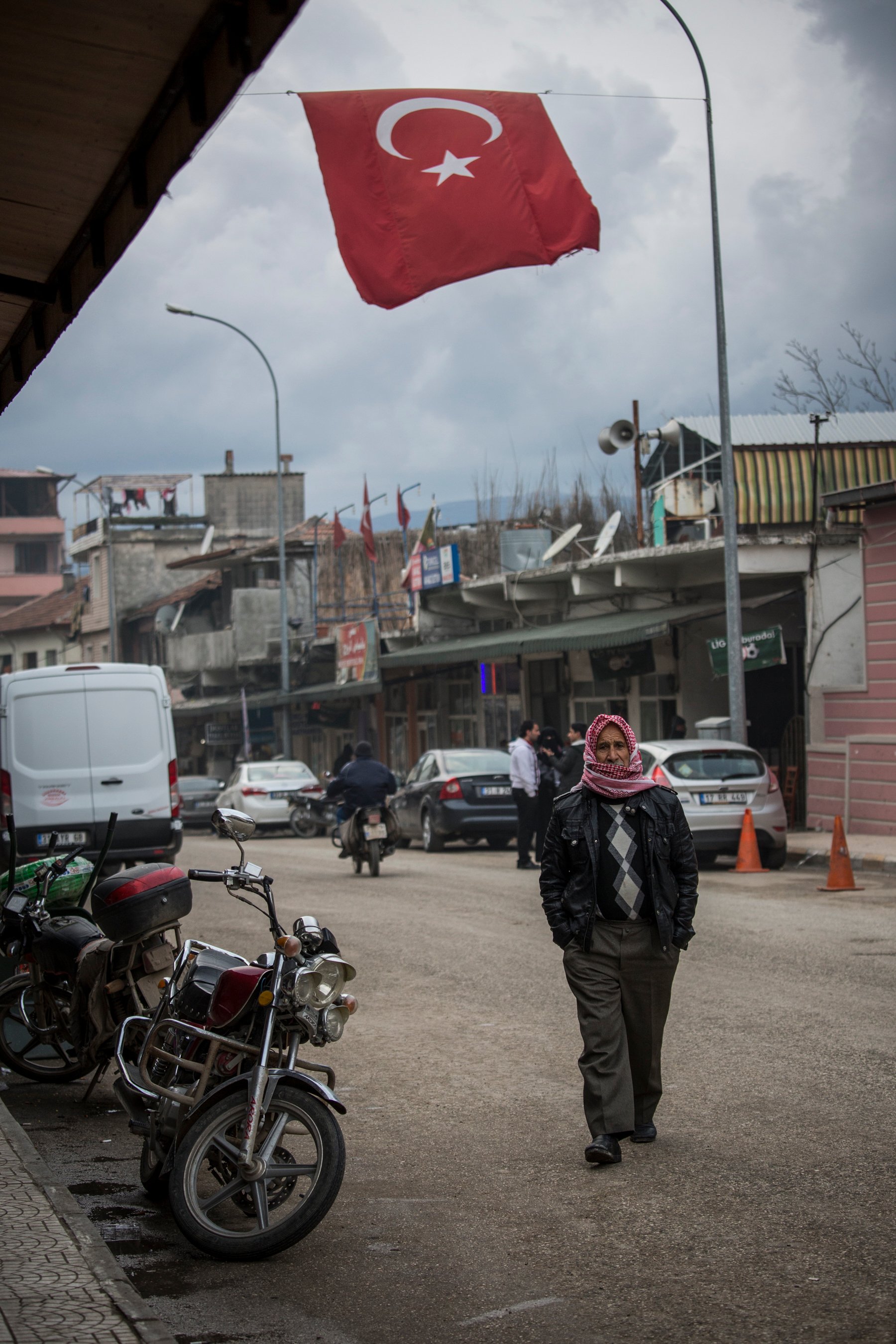 A Syrian man walks in a Turkish town