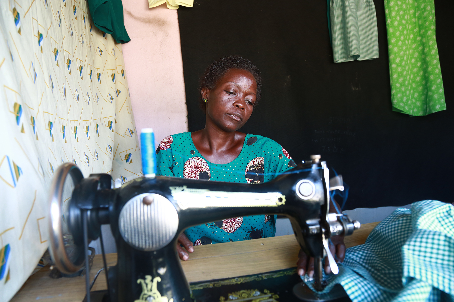 A woman at a sewing machine 