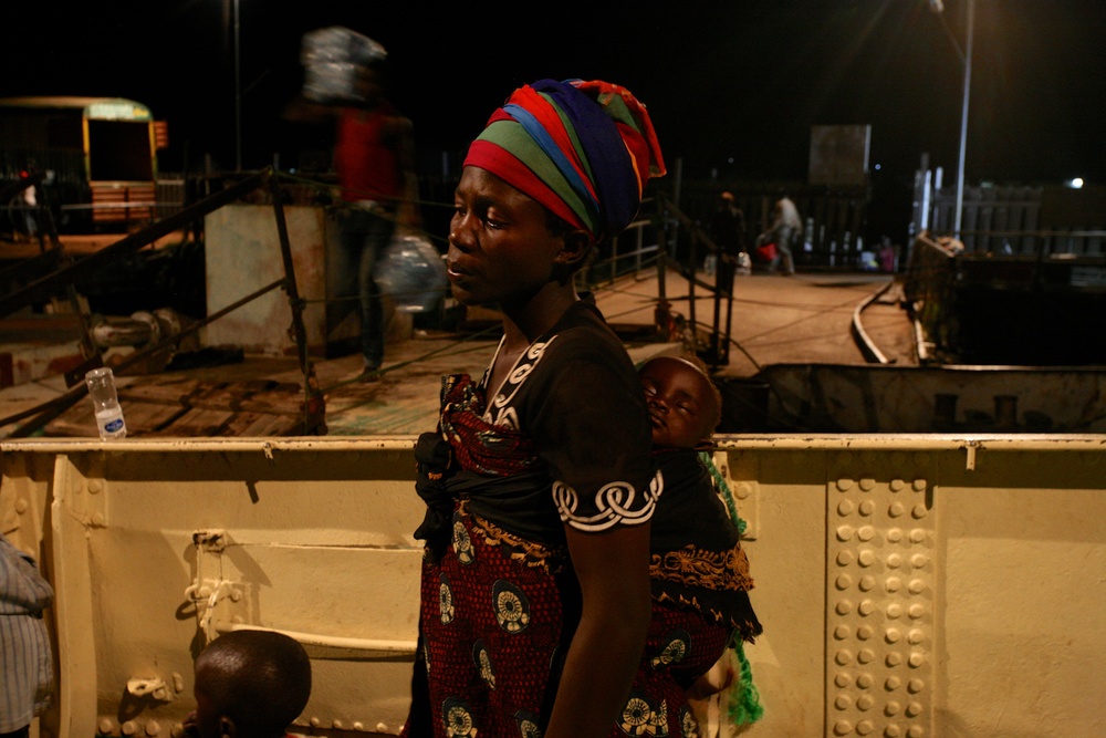 Delphin Nyiyanwi waits aboard the MV Liemba for the body of her 4-year old son to be carried off the boat after he died of suspected cholera.  “