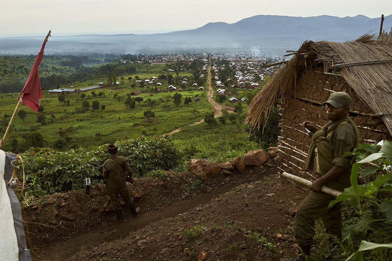 Two FARDC soldiers keep watch over an FARDC base overlooking the town of Kibirizi, North Kivu. 