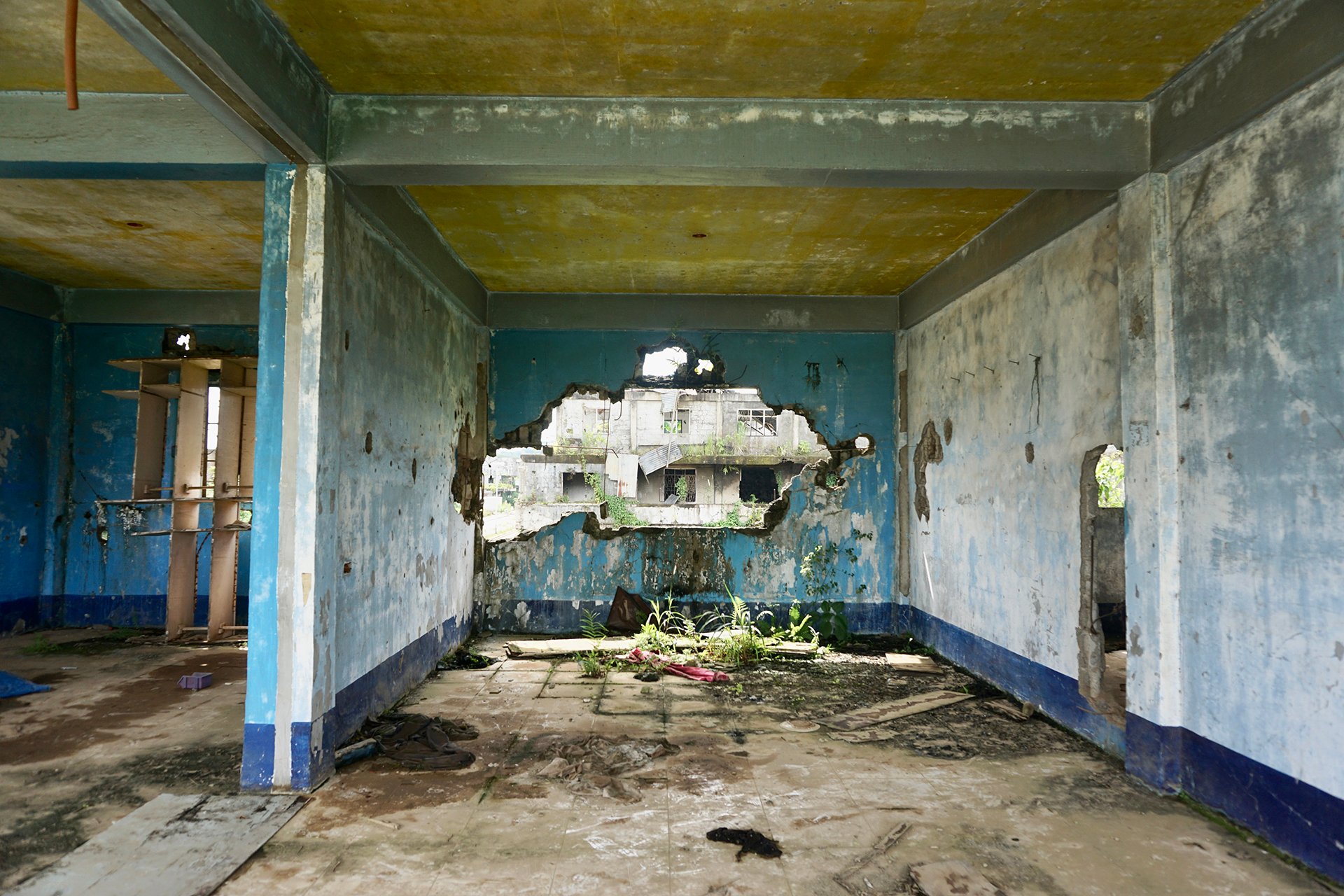 Inside a destroyed building in Marawi City. Those working to demobilise ex-fighters here often say, "there must never be another Marawi siege".