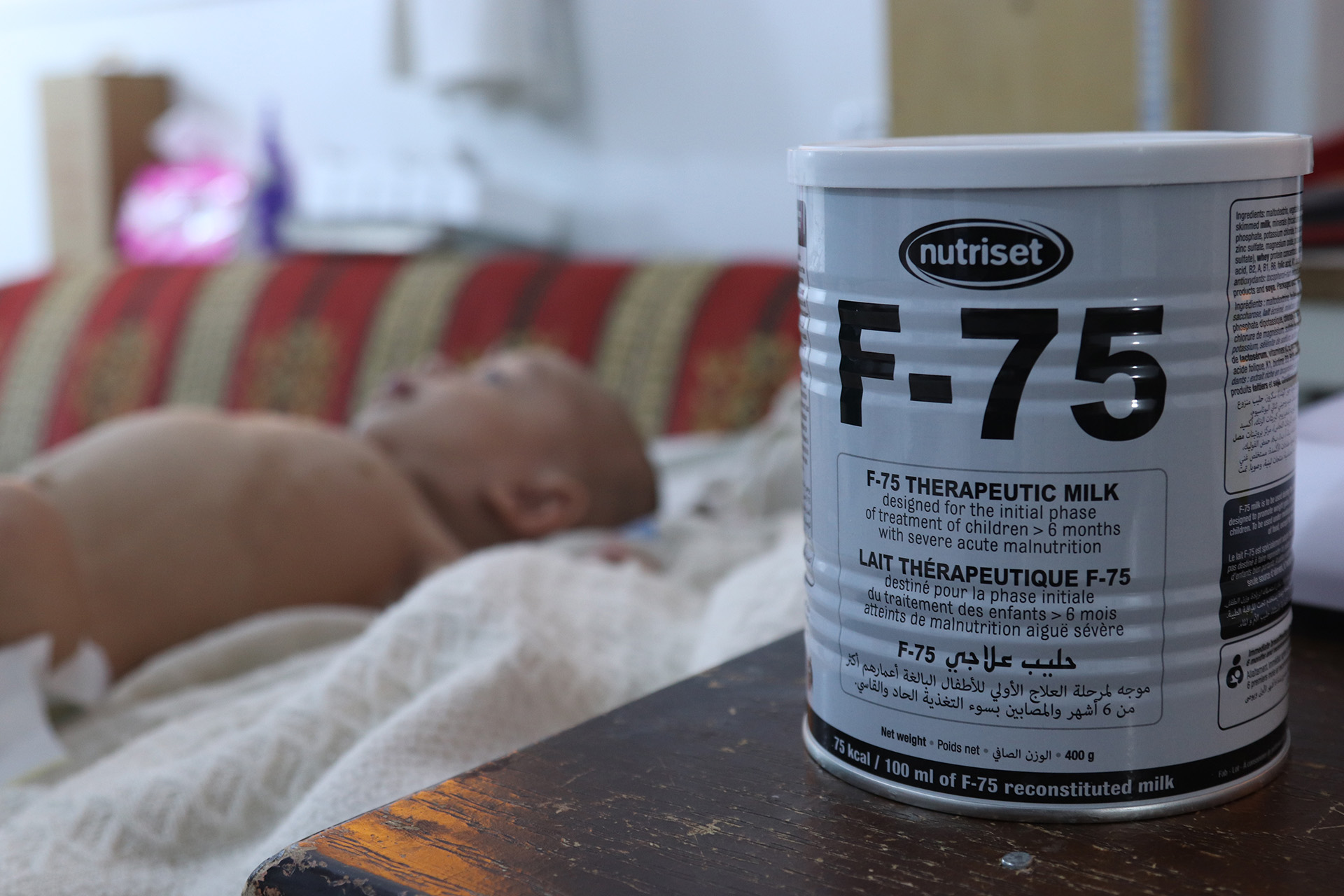 An infant at al-Nour hospital in northwest Syria’s Idlib province is treated with F-75, a form of powdered milk that is designed to help stabilise patients with severe acute malnutrition.