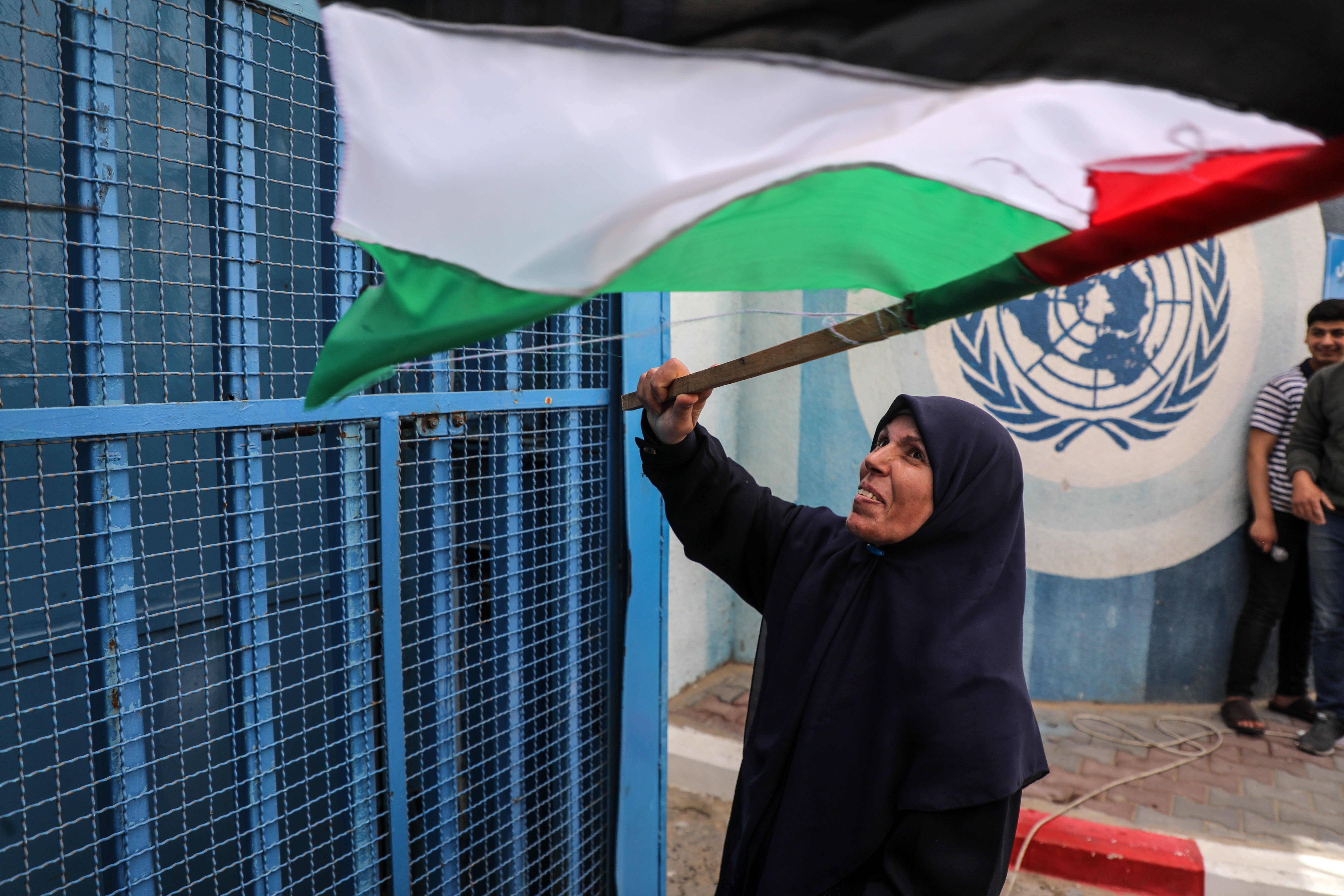 Palestinians protest delays in the reconstruction of homes destroyed in the May 2021 war outside UNRWA offices in Gaza City, on 25 April 2022.