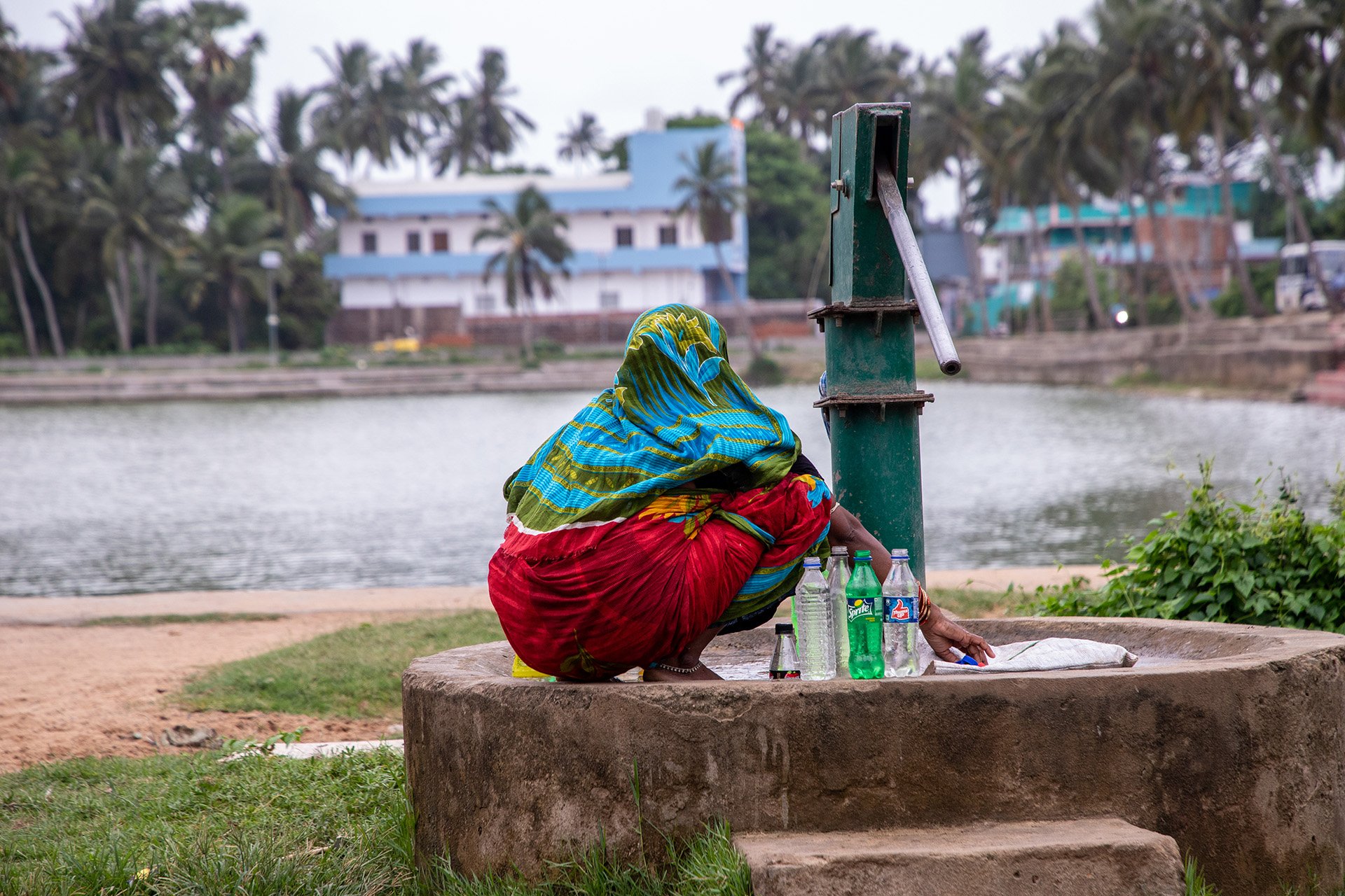 A Dalit woman sitting next to a hand pump in Narasinghpatna that was washed by members of other castes every time a Dalit used it after the cyclone.