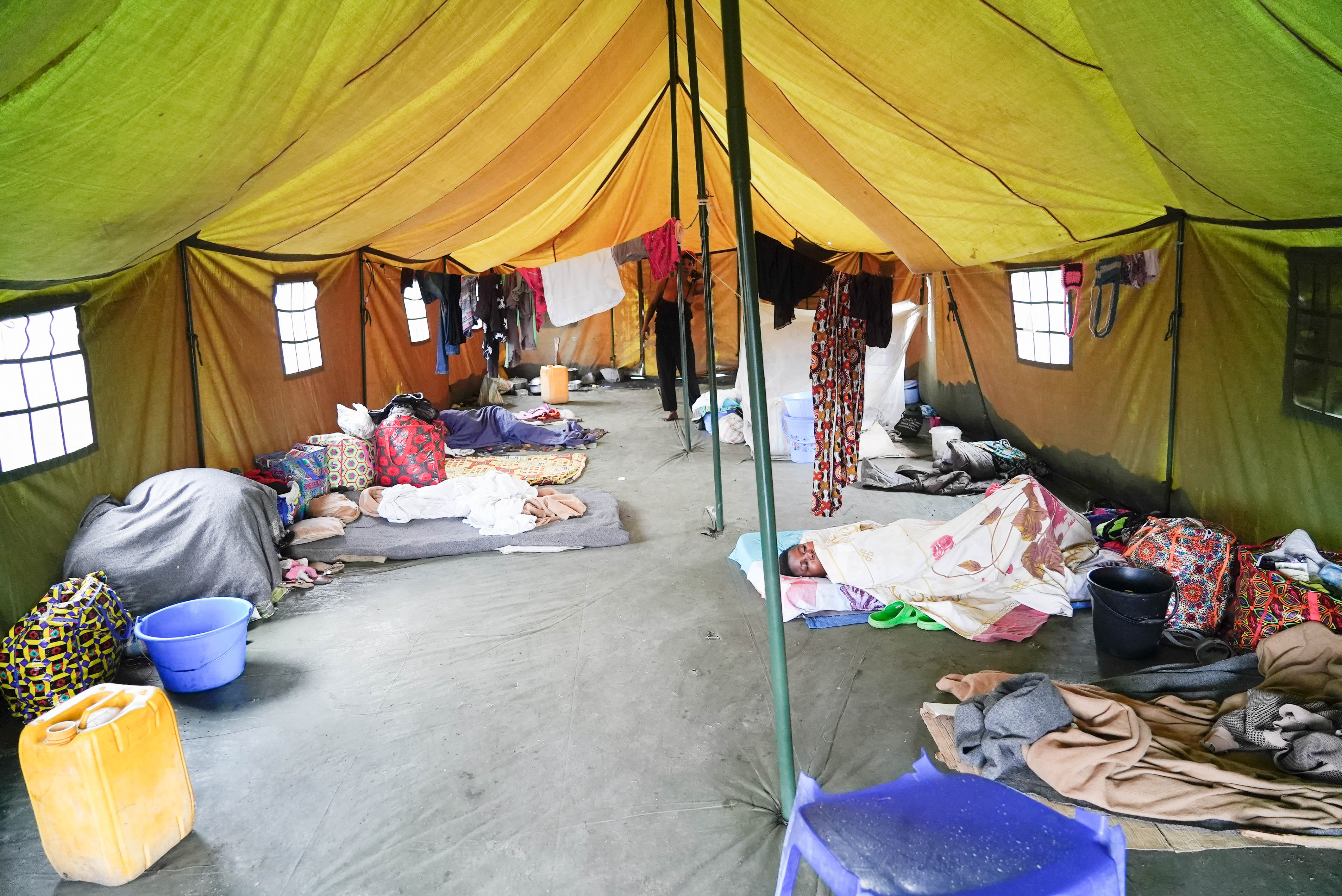 Ex-combatants sleep on the floor at Mubambiro cantonment site in eastern DRC. Fighters have tried to leave the camp in recent months citing poor conditions. 