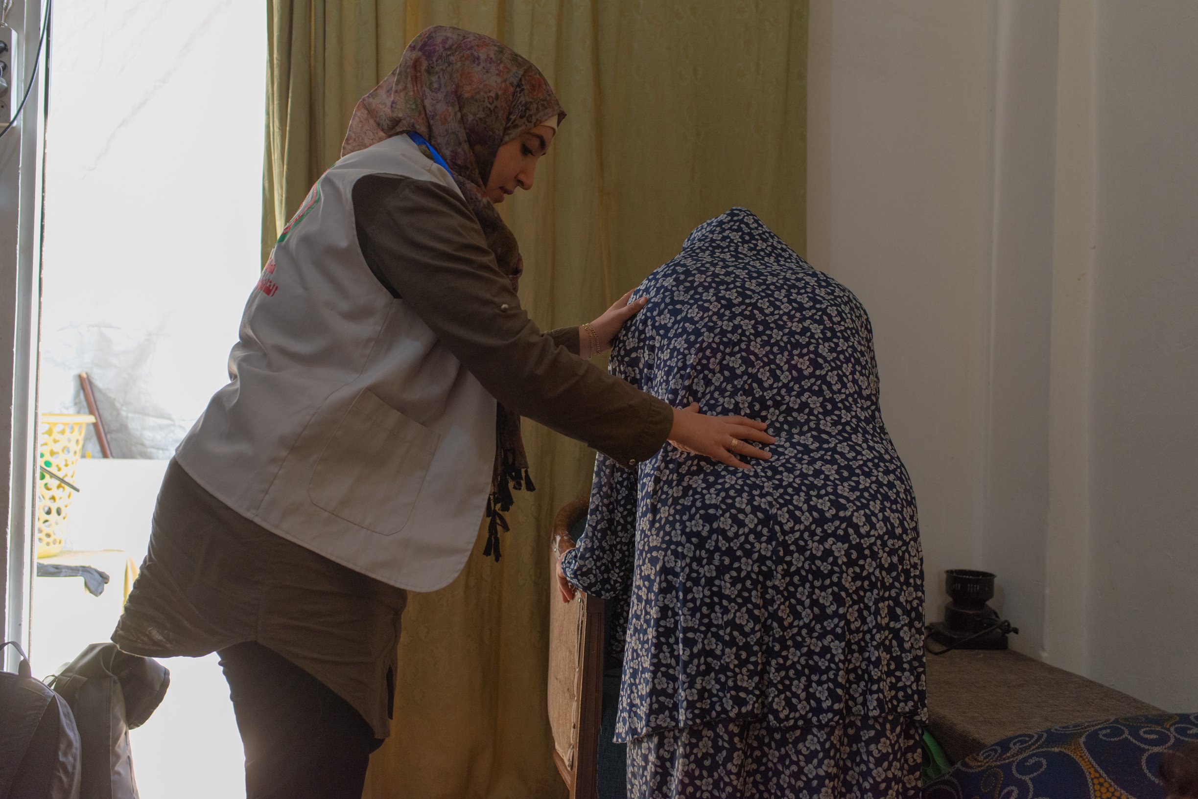 Barakat demonstrates exercises that pregnant women can do to relieve back pain.