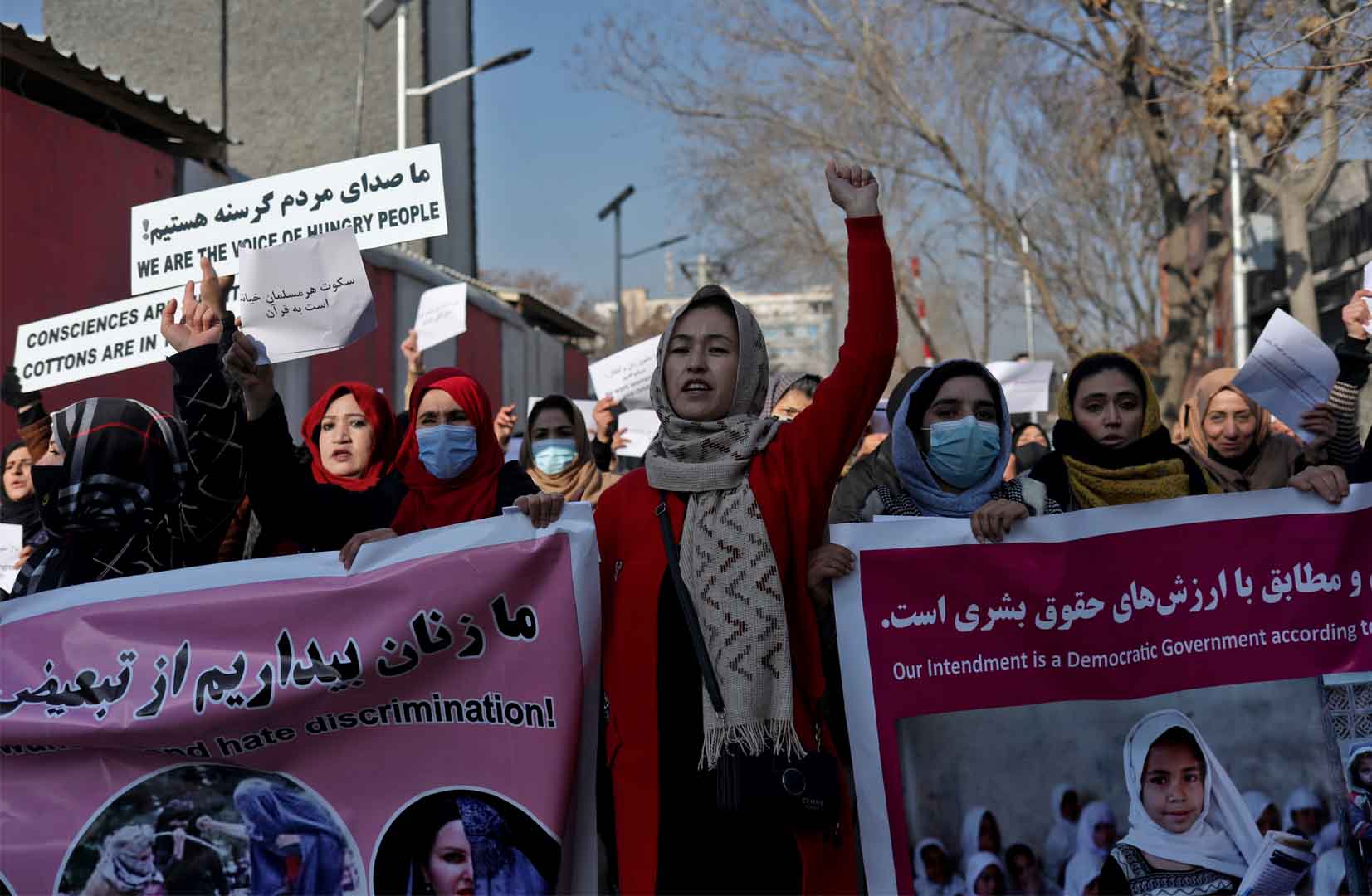 Afghan women shout slogans during a rally in Kabul to protest Taliban restrictions on women, on 28 December 2021.