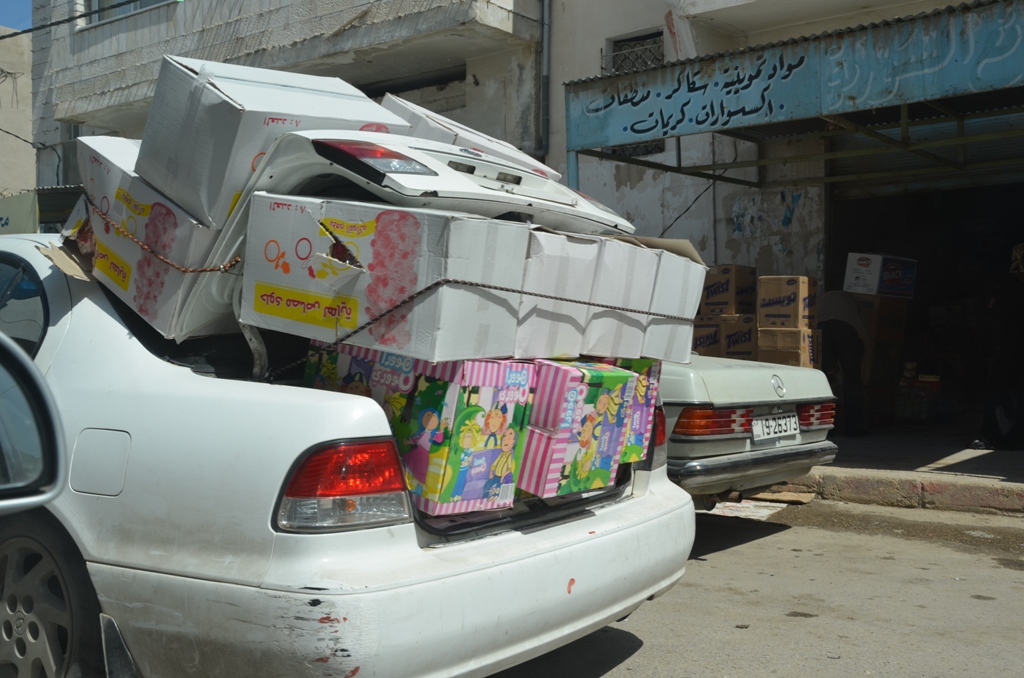 A taxi, stuffed with products, arrives in the Jordanian border town of Remtha from Syria. Despite the unrest, trade across the border has continued. On the way back, these taxis sometimes carry hidden medical supplies to be distributed to those affected by the unrest