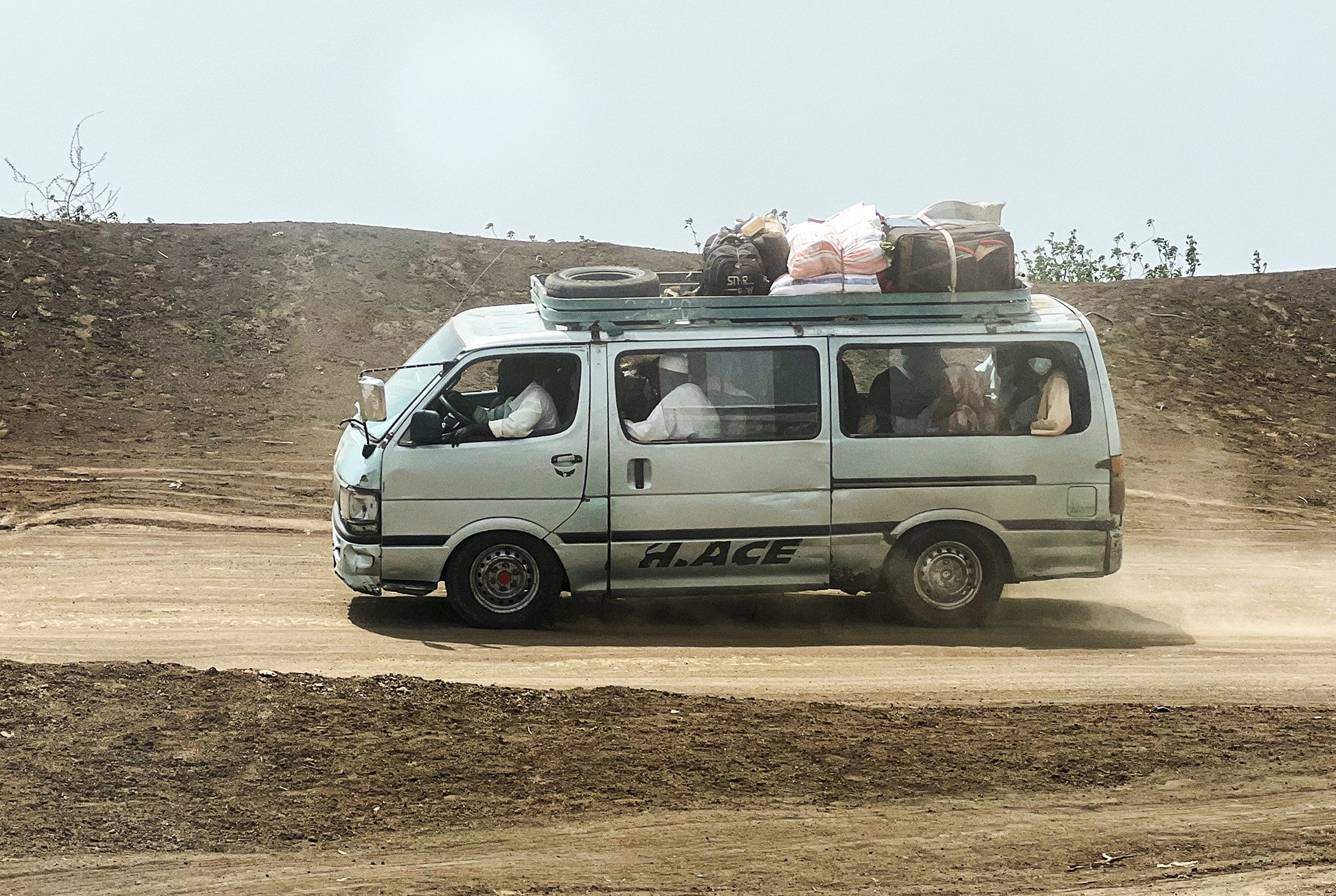 Families flee RSF advances in Sudan's El Gezira state, on Sennar Road in the city of al-Dinder, Sennar state, Sudan, June 12, 2024.