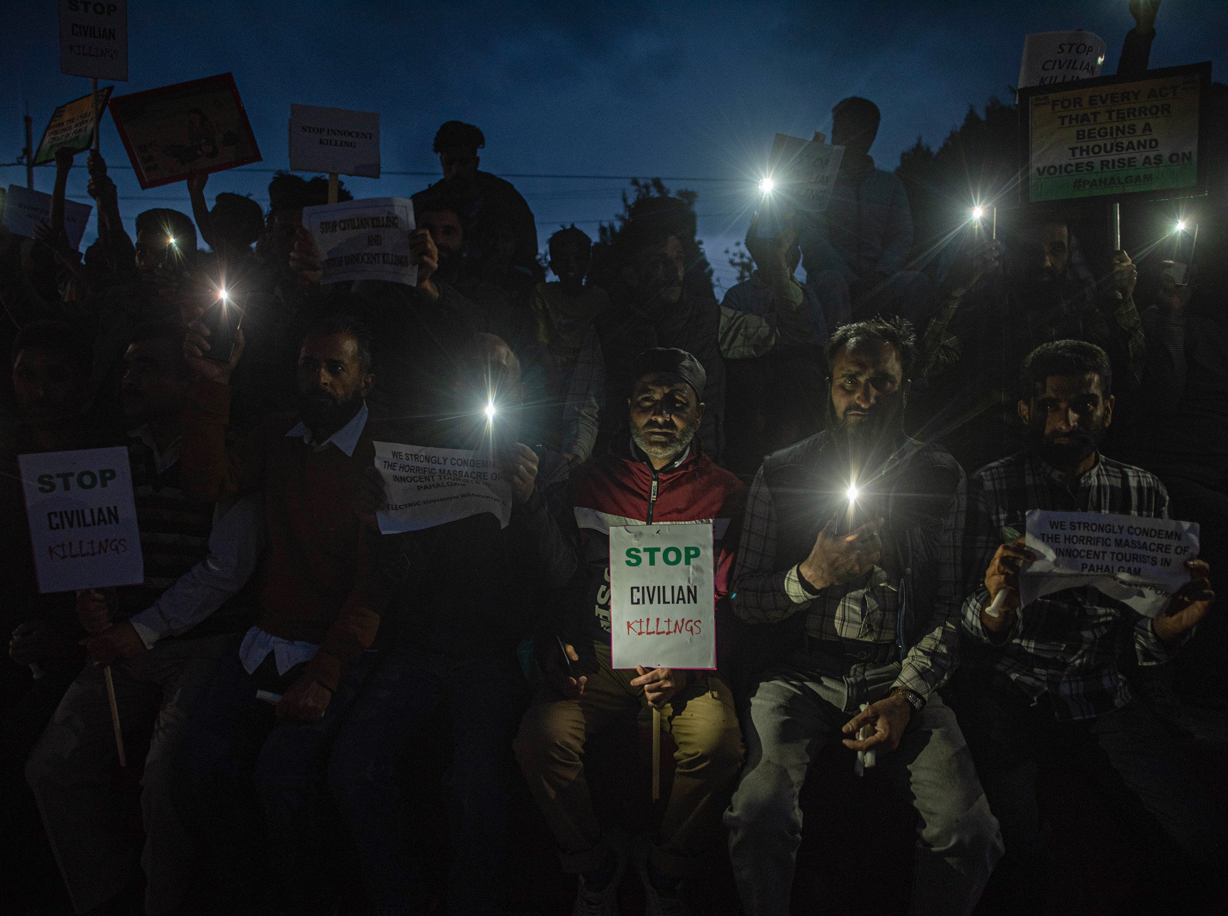 People gather in Bandipora on April 23, 2025 to protest and condemn the killing of civilians in a recent terrorist attack in a popular tourist destination in Pahalgam. According to reports, in this incident at least 26 tourists were killed.