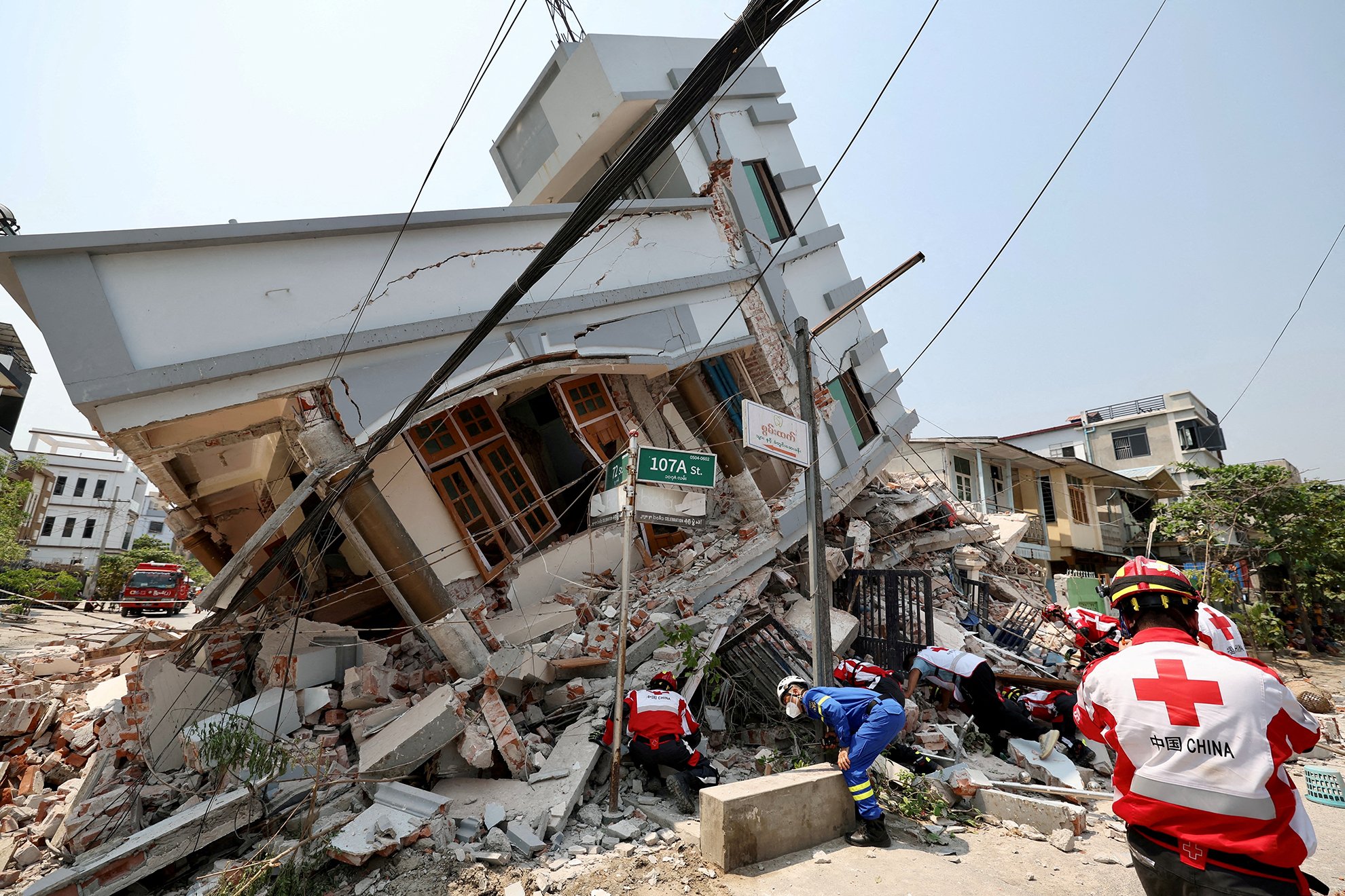 Members of the Chinese Red Cross International Emergency Response Team work at a collapsed residential building following the earthquake, in Mandalay, Myanmar March 31, 2025. 