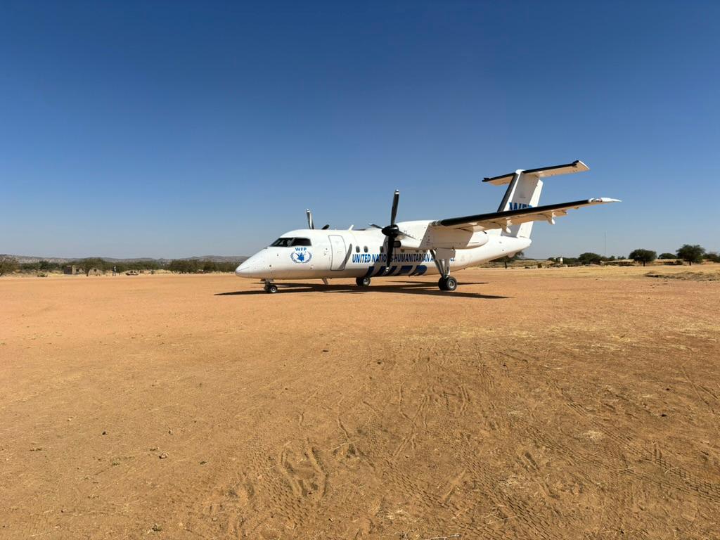 A WFP-branded plane taxis at an airstrip in the Chadian town of Adré, which functions as a cross-border aid hub for Darfur.