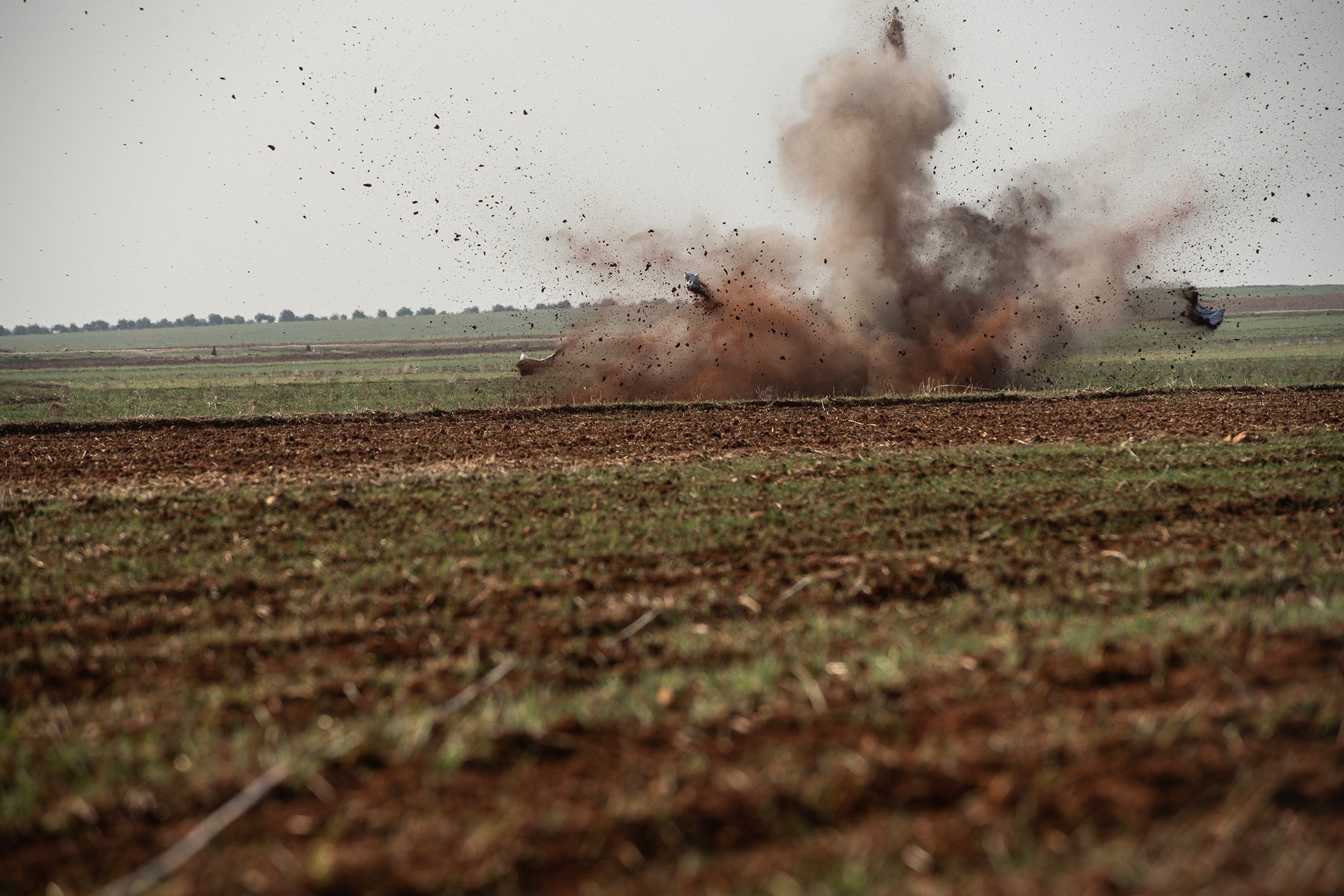 The photo shows a bomb being exploded by a landmine clearance team in Syria.