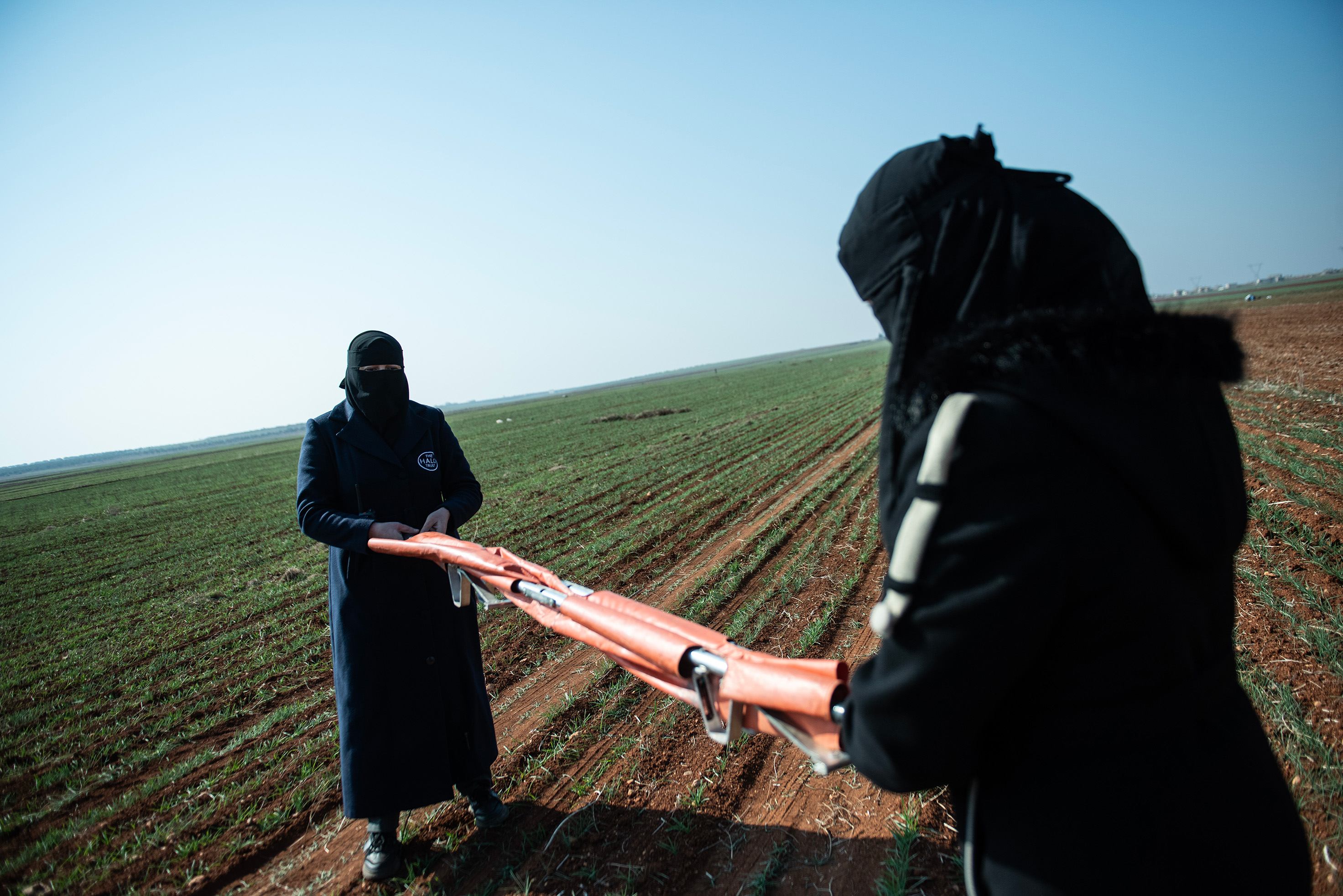 Abu Kaddour and a colleague pack up the medical equipment they always have on hand in case of an accident.