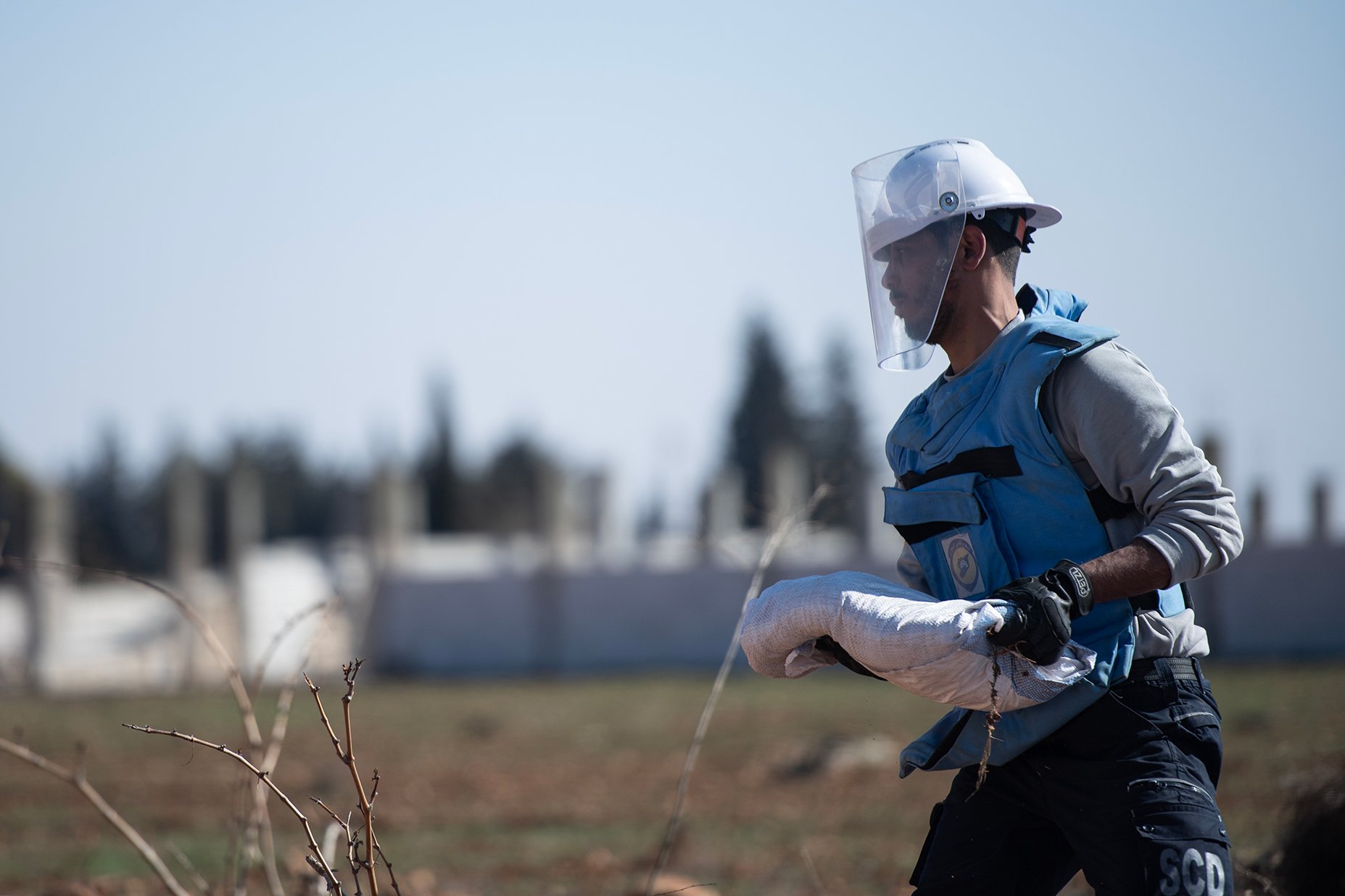 Ammar Zamam, a member of the White Helmets (The Syrian Civil Defense) team while in a mission to remove unexploded items from an agricultural land in Rural Homs.