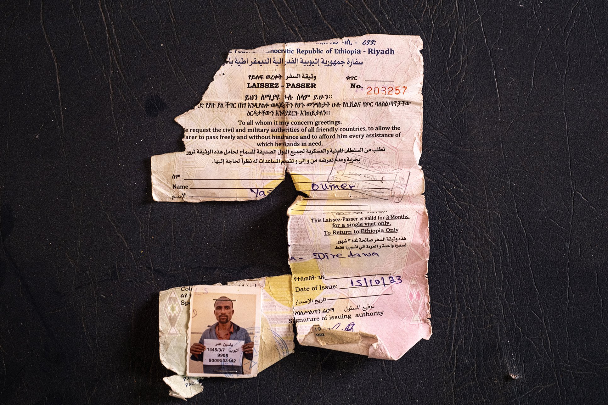 A crumpled laissez-passer with which a man called Yasin Oumer was deported to Ethiopia from a Saudi Arabian prison.