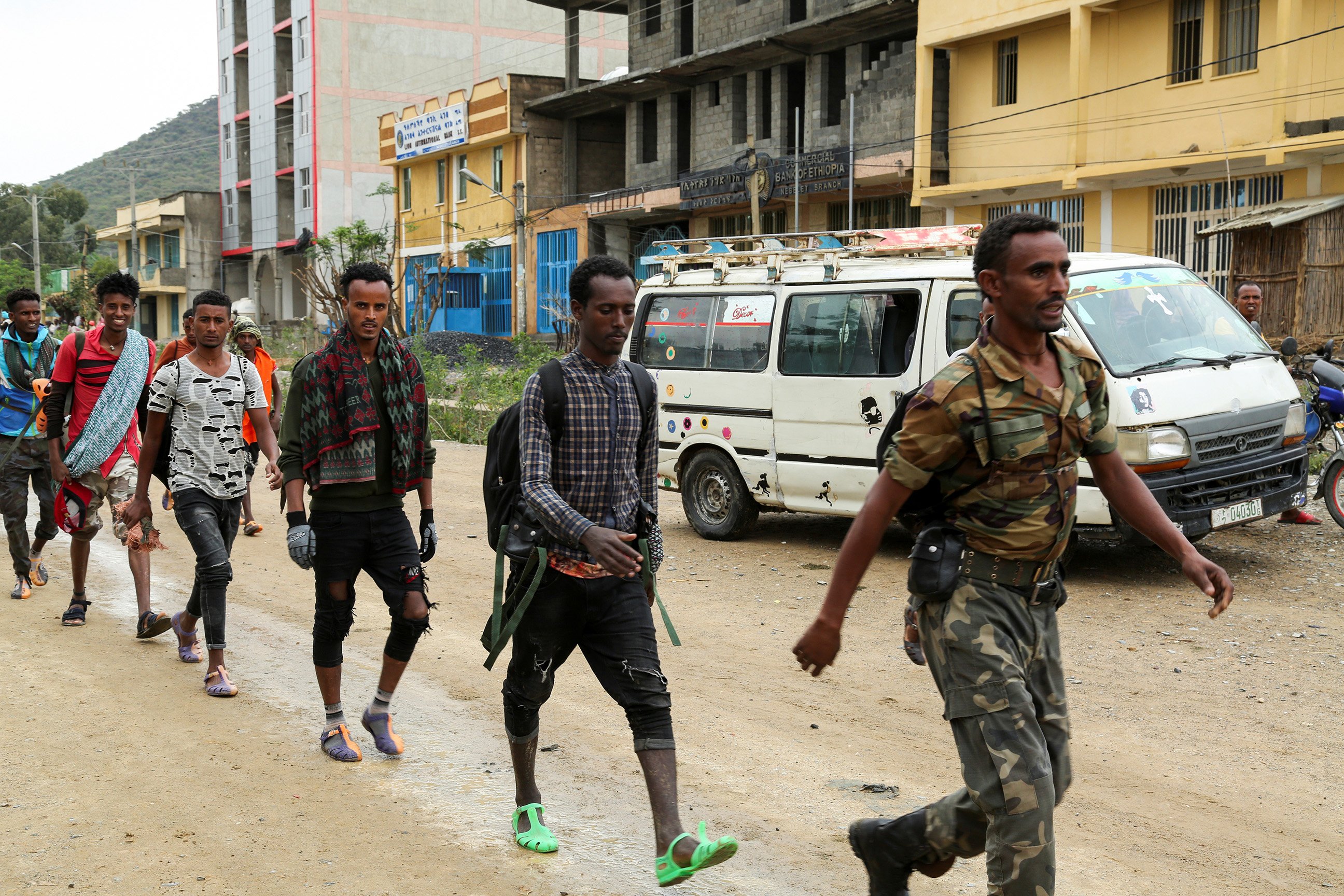 Newly recruited youth joining Tigrayan forces march through the village of Nebelet, northern Tigray, Ethiopia, July 11, 2021.
