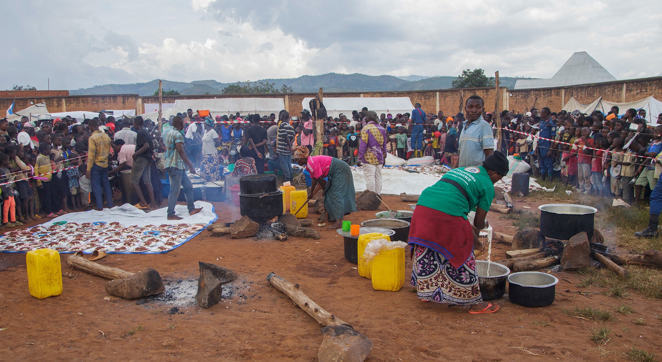 Burundian volunteers prepare food for Congolese families at Rugombo Stadium, after Congolese fled from renewed clashes between M23 rebels and the Armed Forces of the Democratic Republic of the Congo (FARDC), in Rugombo commune of Cibitoke Province, Burundi February 18, 2025.
