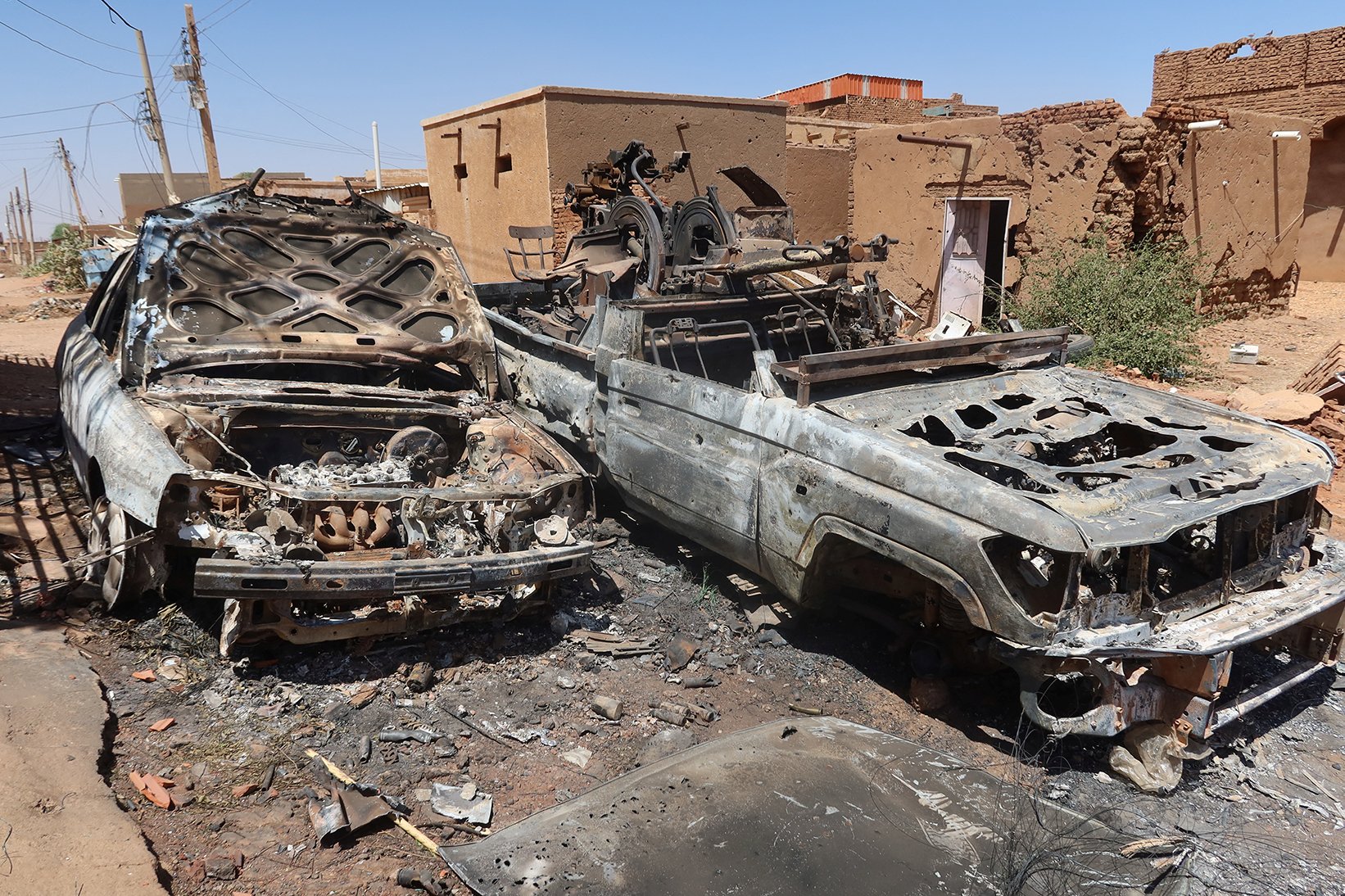 A photo of Destroyed combat vehicles in the Sharg Elnil area of Khartoum, Sudan.