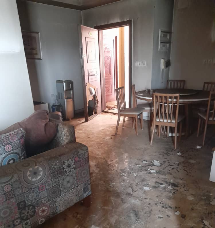 A photo from within the home of Mohammed Amin. The door has a hole from being kicked open by RSF fighters. 