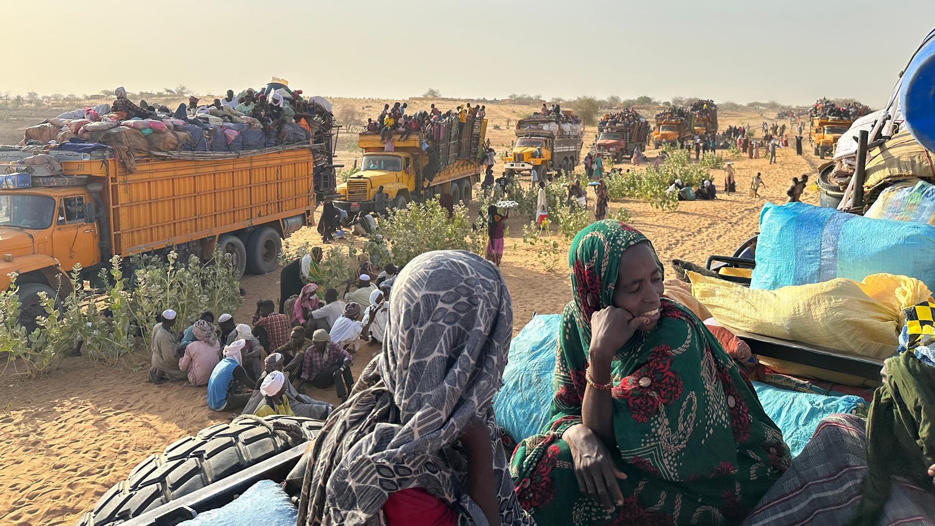 Families escaping RSF attacks on the famine-hit Zam Zam displacement camp arrive with their belongings on trucks in Tawila, a small town in North Darfur state that has become an epicenter of Sudan's displacement crisis.