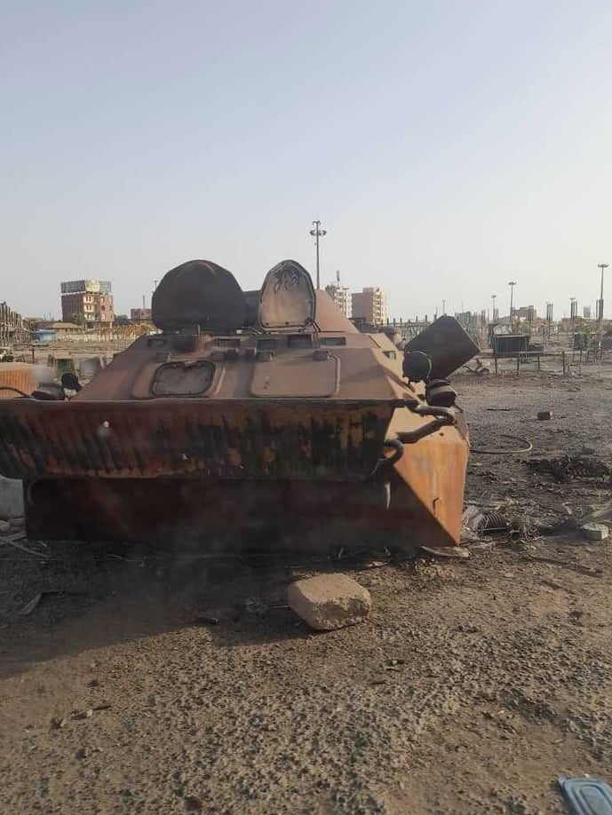 An abandoned tank sits exposed in an empty lot in Khartoum, which was recently reclaimed by the Sudanese army after a two-year occupation by the Rapid Support Forces.