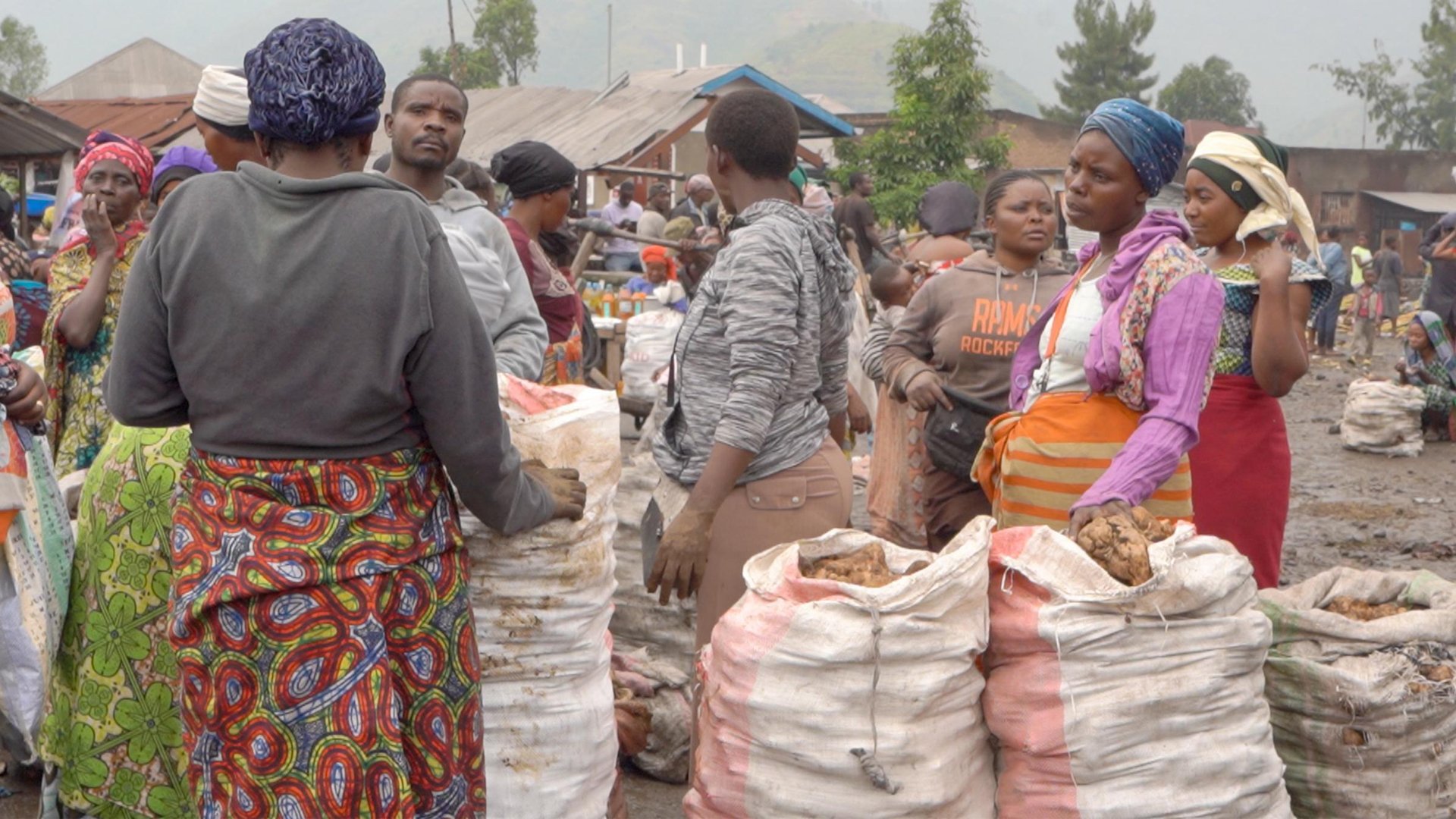 Women trade goods at a market in Sake despite a general economic slowdown caused by the conflict and the collapse of the local banking system.