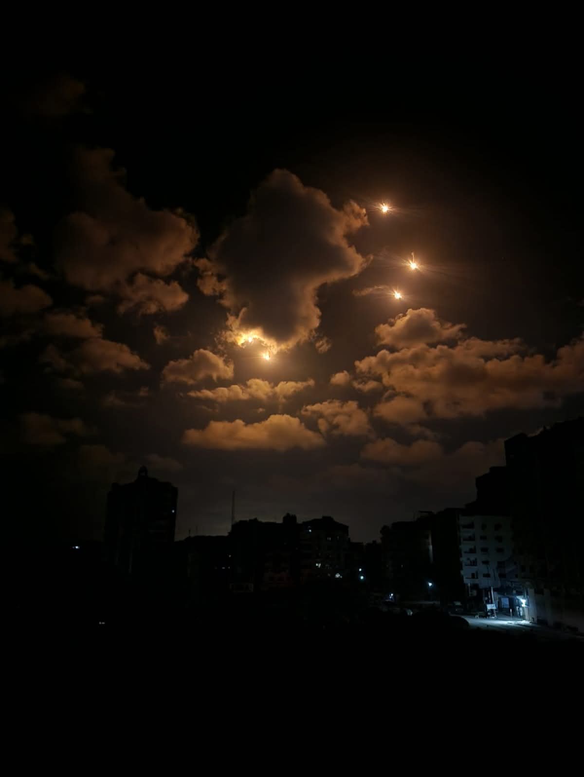  Israeli military flares lighting up the night sky on 9 September, spreading fear among displaced people in the neighbourhood where Rasha Abou Jalal and her family were staying in western Gaza City.