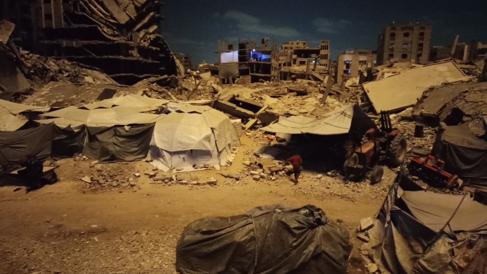 Flares fired by the Israeli military illuminating tents housing displaced Palestinian in the neighbourhood where Rasha Abou Jalal and her family were staying in western Gaza City before people began evacuating en masse on 13 September. 
