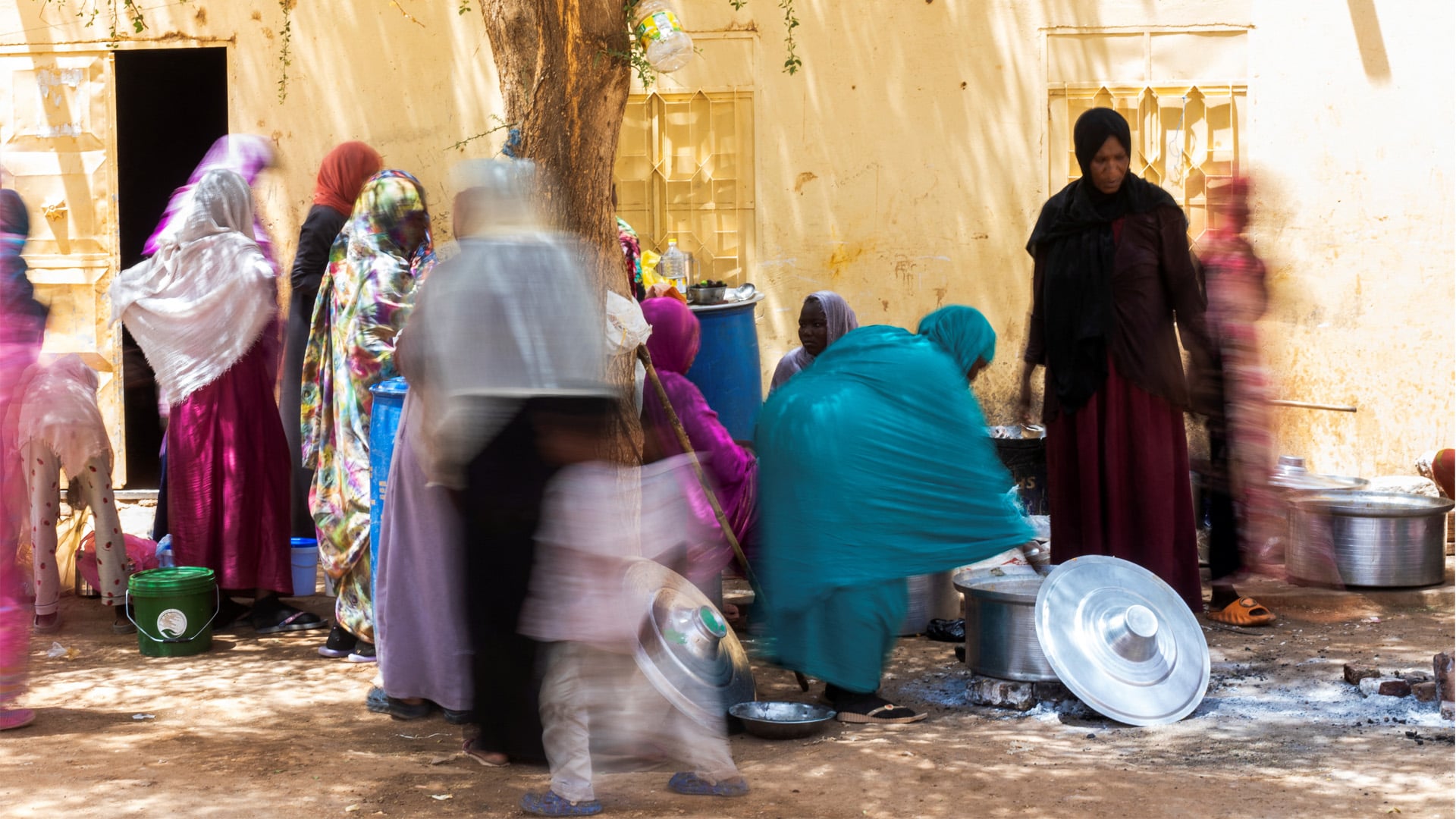 Sudanese women from community kitchens, run by local volunteers, prepare meals for people who are affected by conflict and extreme hunger and are out of reach of international aid efforts, in Omdurman, Sudan, May 27, 2024. 