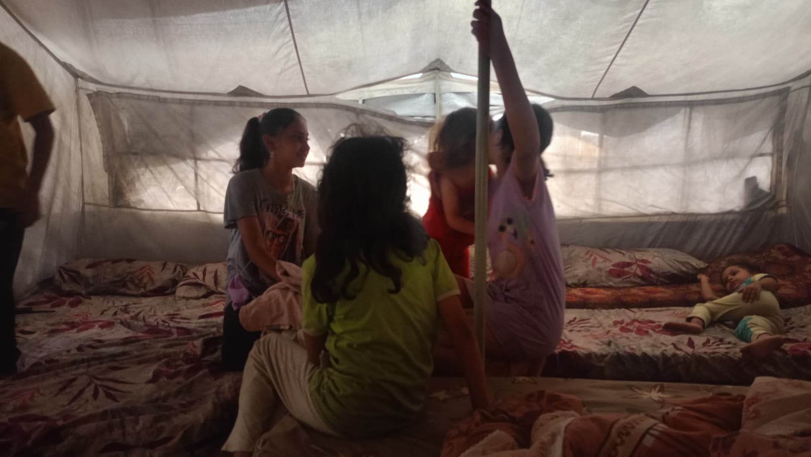 Rasha Abou Jalal's children in their tent in Nuseirat.