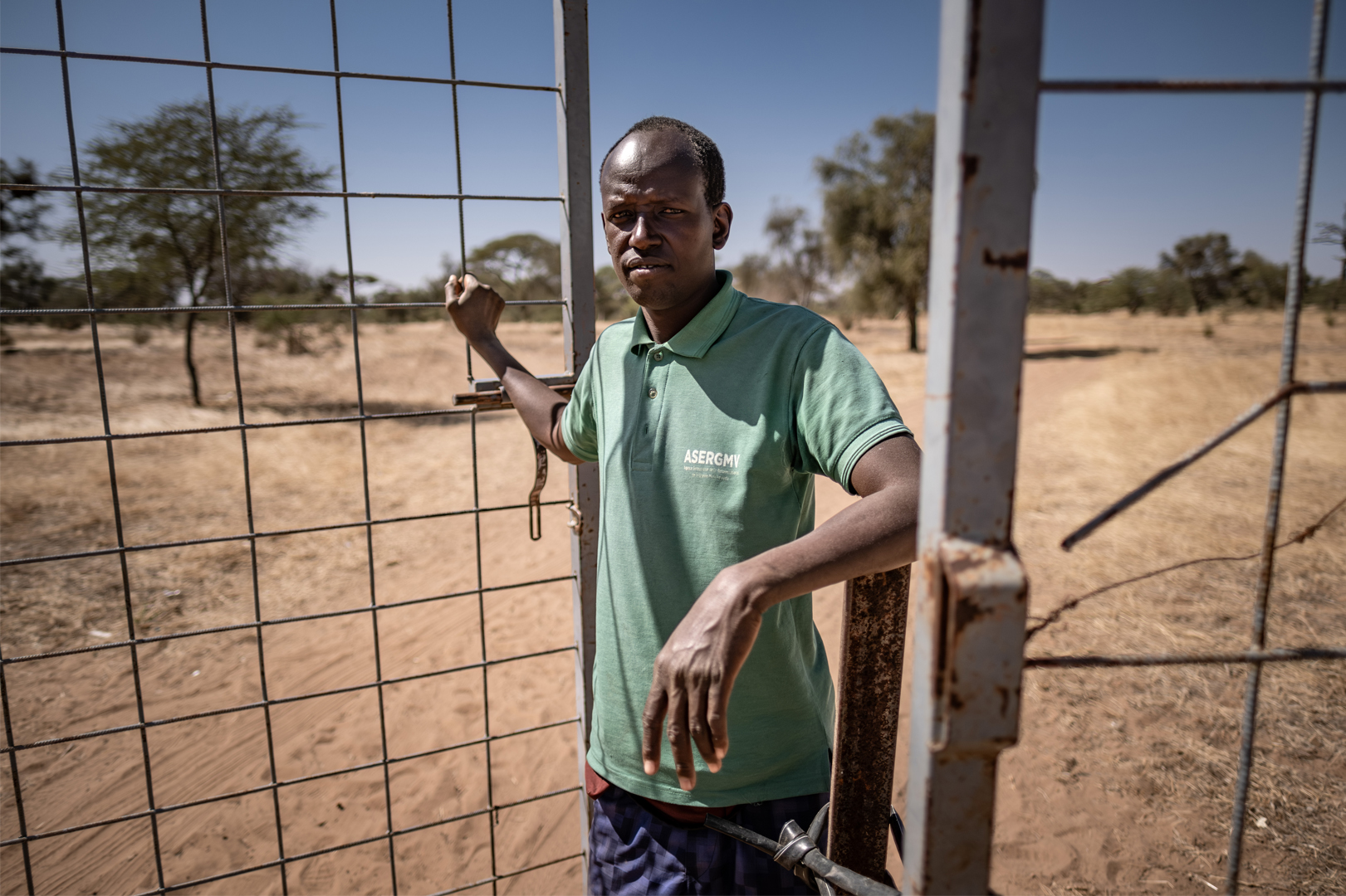 A guard stands at the entrance of the Koyli Alpha community reserve in Senegal.