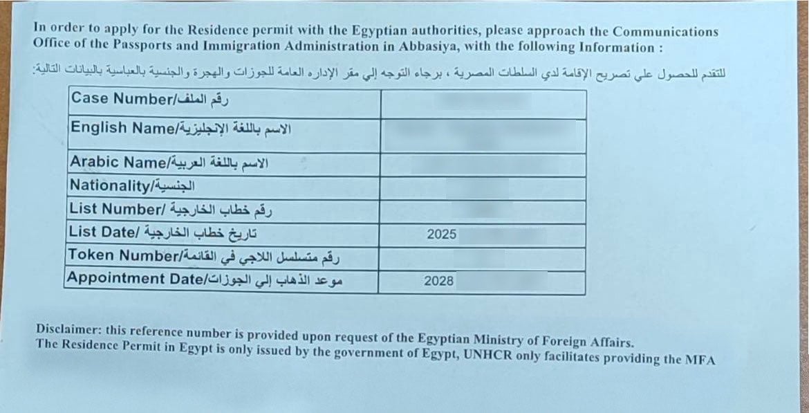 An appointment slip directs a Sudanese refugee to Egyptian authorities to apply for residency, but the date is set for March 2028. Application backlogs have left many refugees without legal status and at risk of detention and deportation.