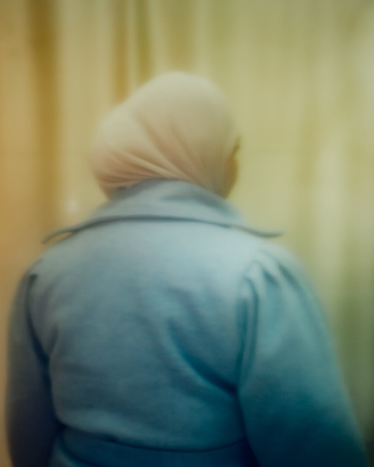 A portrait photo showing the back of Amira.