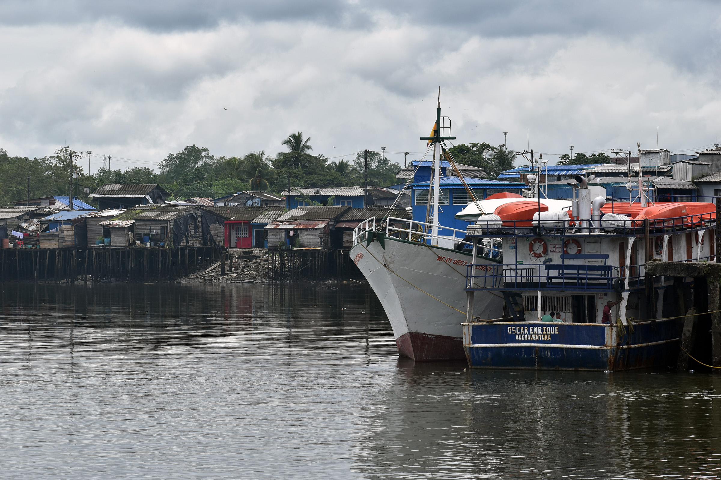 Docks in a residential area of Buenaventura, Colombia, where migrant boats often arrive at the main industrial landing point, attracting less attention from authorities.
