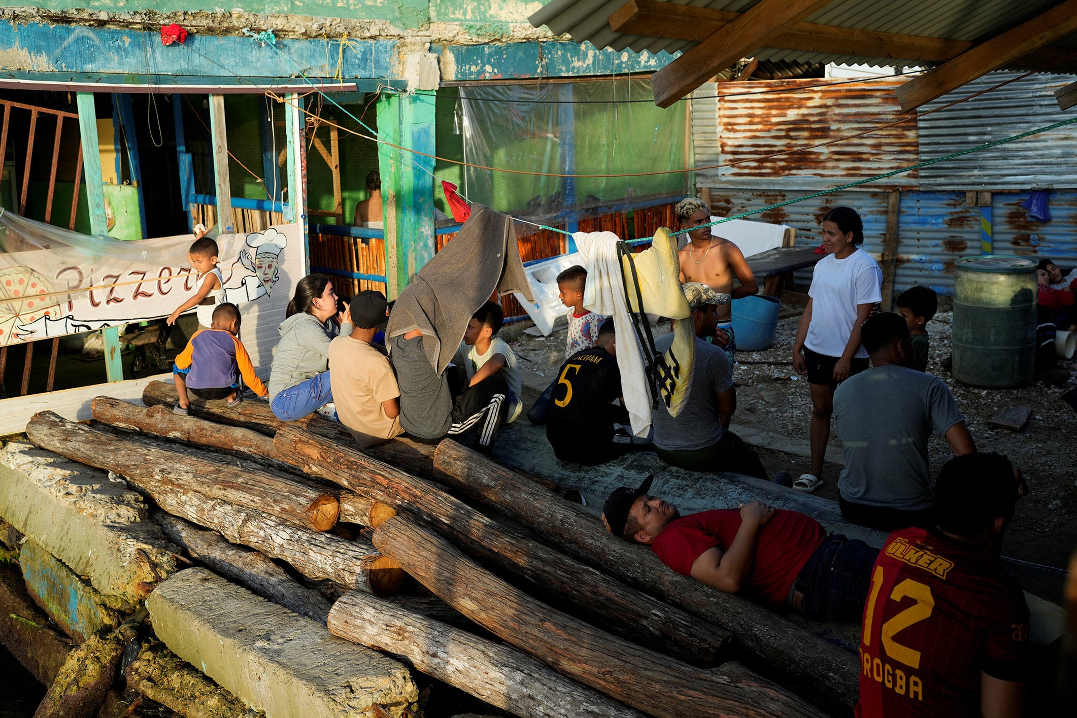 Venezuelan migrants, who were hoping to reach the U.S. and decided to return to their country due to U.S. President Donald Trump's new immigration policies, wait for a boat to take them to the Colombian border, in Gardi Sugdub, Panama, February 23, 2025. 