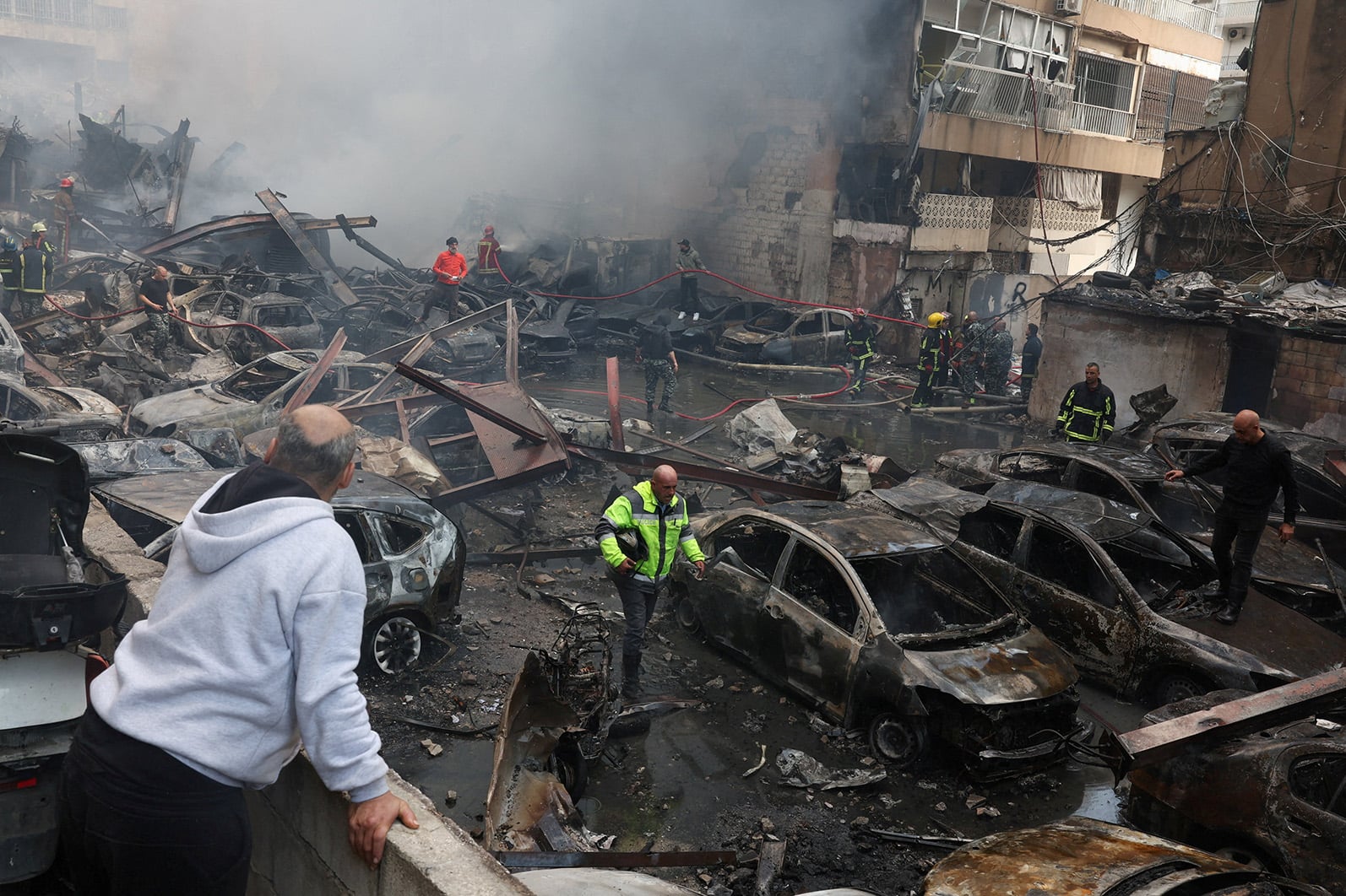 Emergency responders at the site of an Israeli strike in Beirut, 8 April 2026.