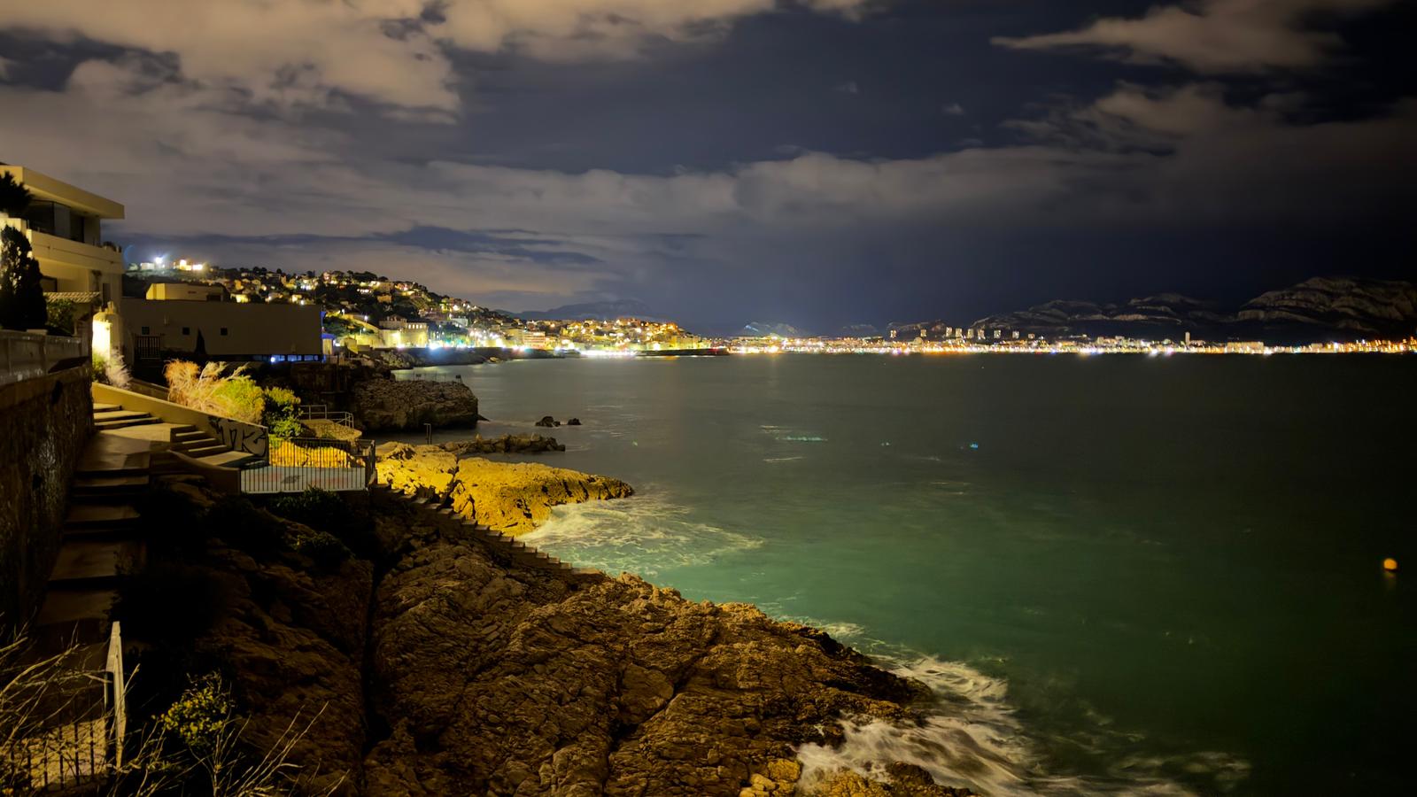 The shoreline of Marseille, France at night.