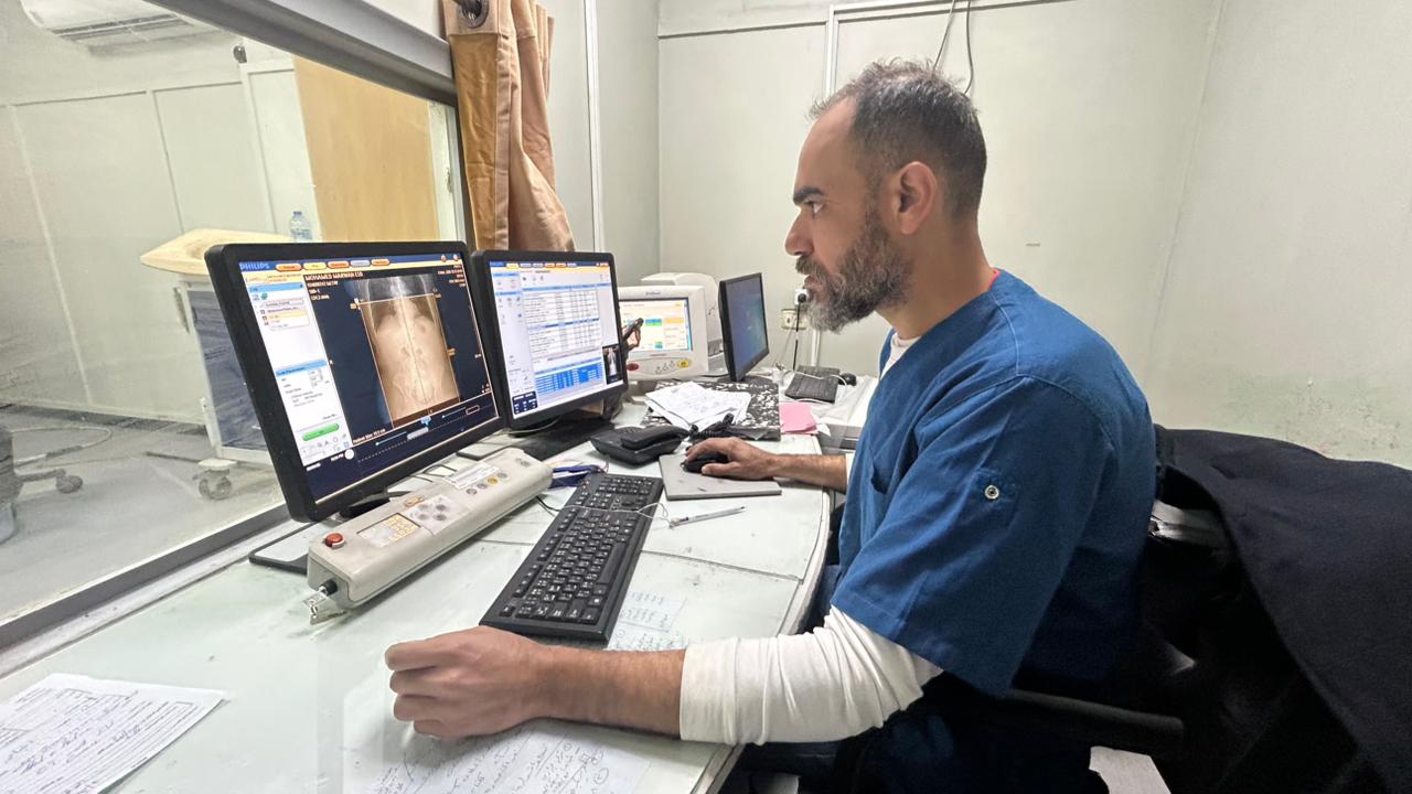 Mohamed Abu Musa, a diagnostic radiology specialist, operates the only functioning CT scanner in southern Gaza at Nasser Medical Complex in Khan Younis.