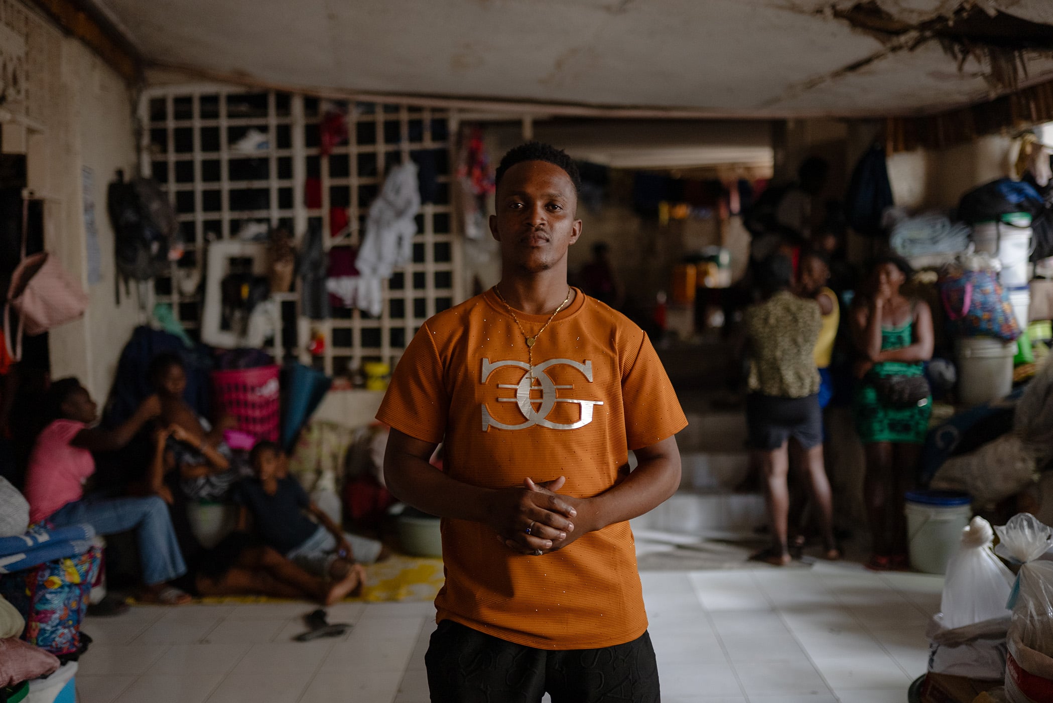 A portrait of Yvenel Louis, who helps manage the Club International displacement site, a former nightclub in Port-au-Prince, Haiti,&nbsp; June 2026.