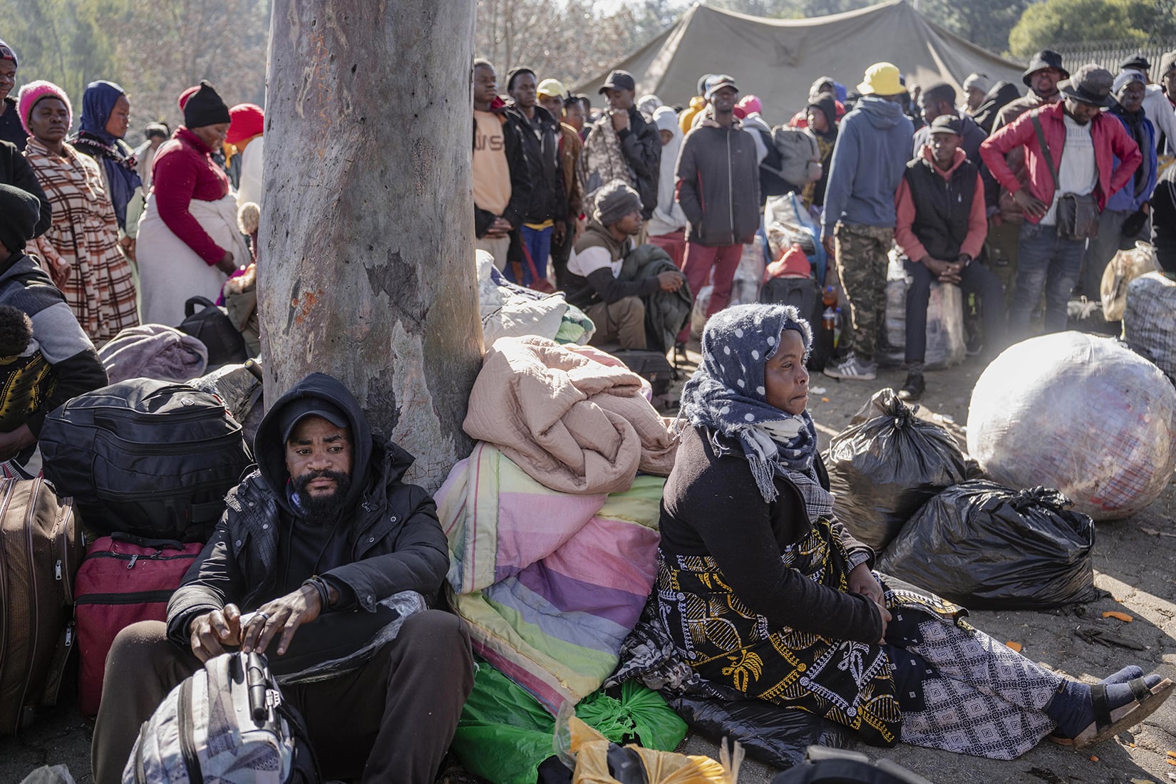 A group of Malawian undocumented migrants gather in front of the Malawian Consulate building to prepare for their return home by buses following a resurgence of xenophobic attacks and anti-migrant protests in Johannesburg, South Africa on 30 June 2026. 