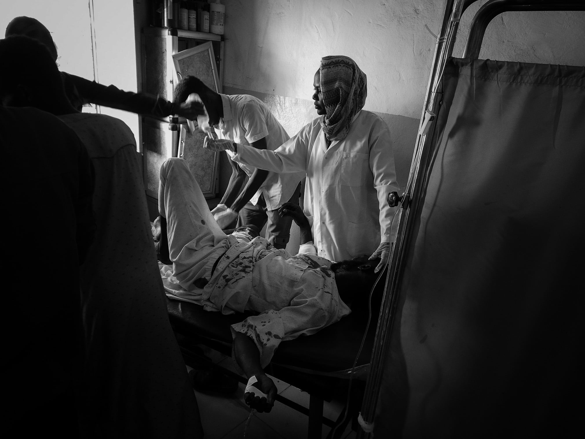 A photo of medical workers who stayed during the siege to protect civilians amid constant shelling and famine conditions.