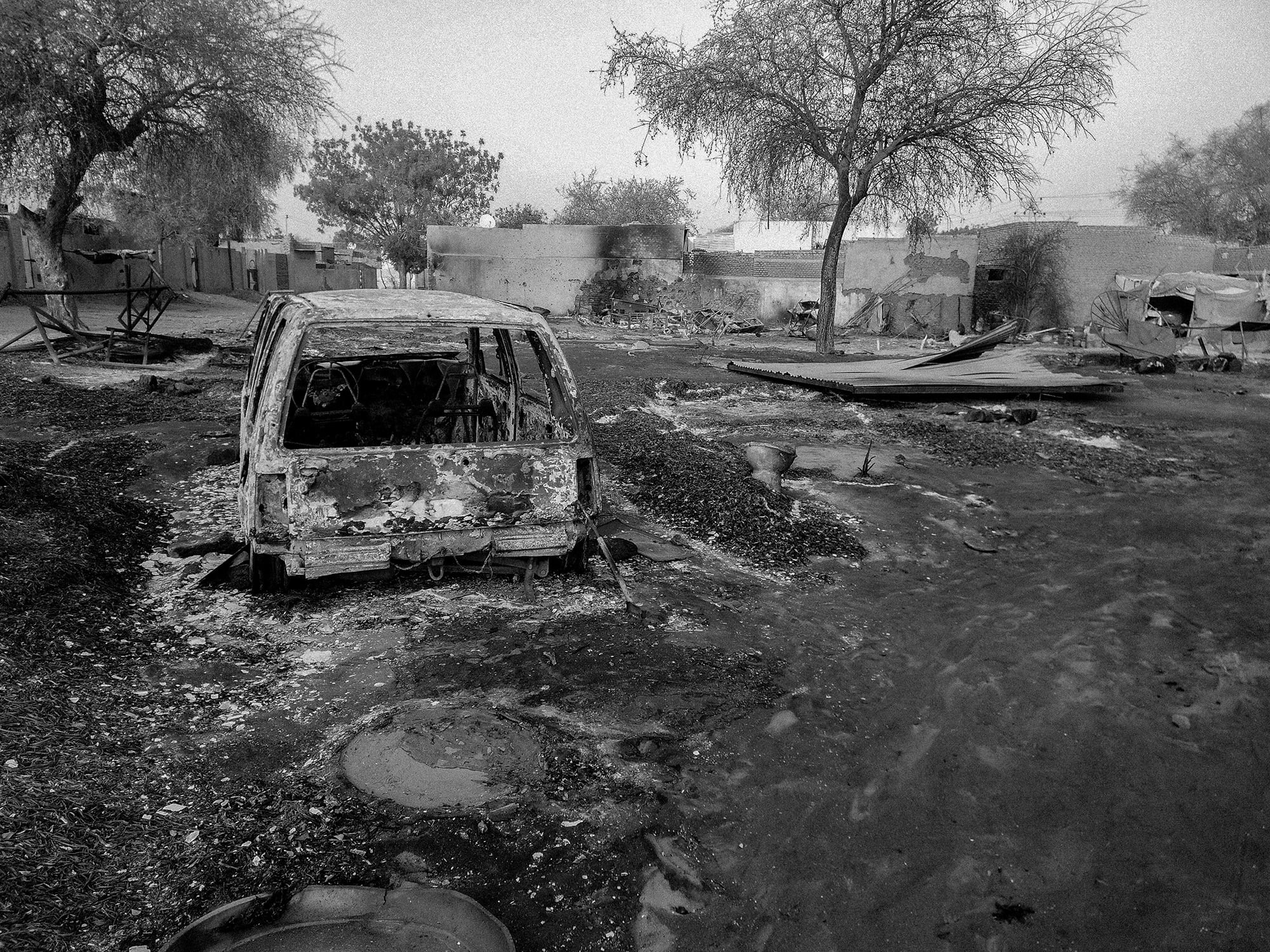 The wreckage of a burnt-out vehicle struck by an artillery during the 500-day RSF siege on El Fasher.