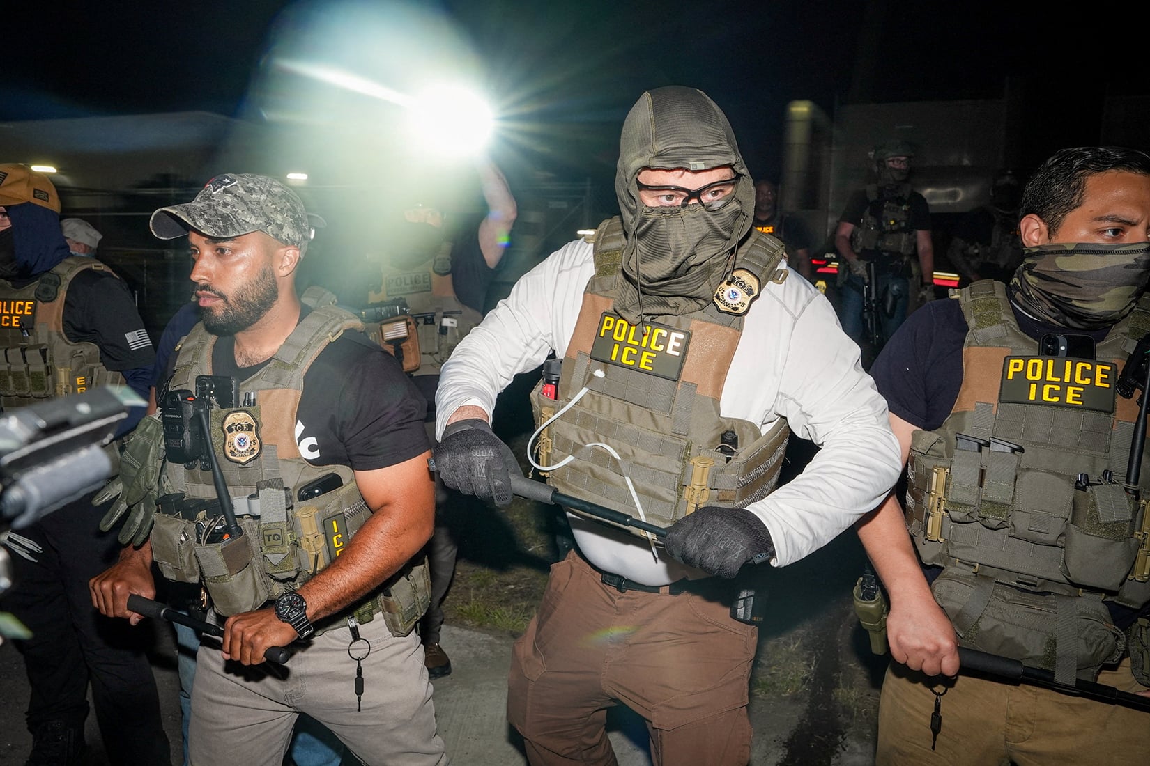 ICE agents stand guard during a protest outside Delaney Hall in Newark, New Jersey, U.S., 27 May 2026.