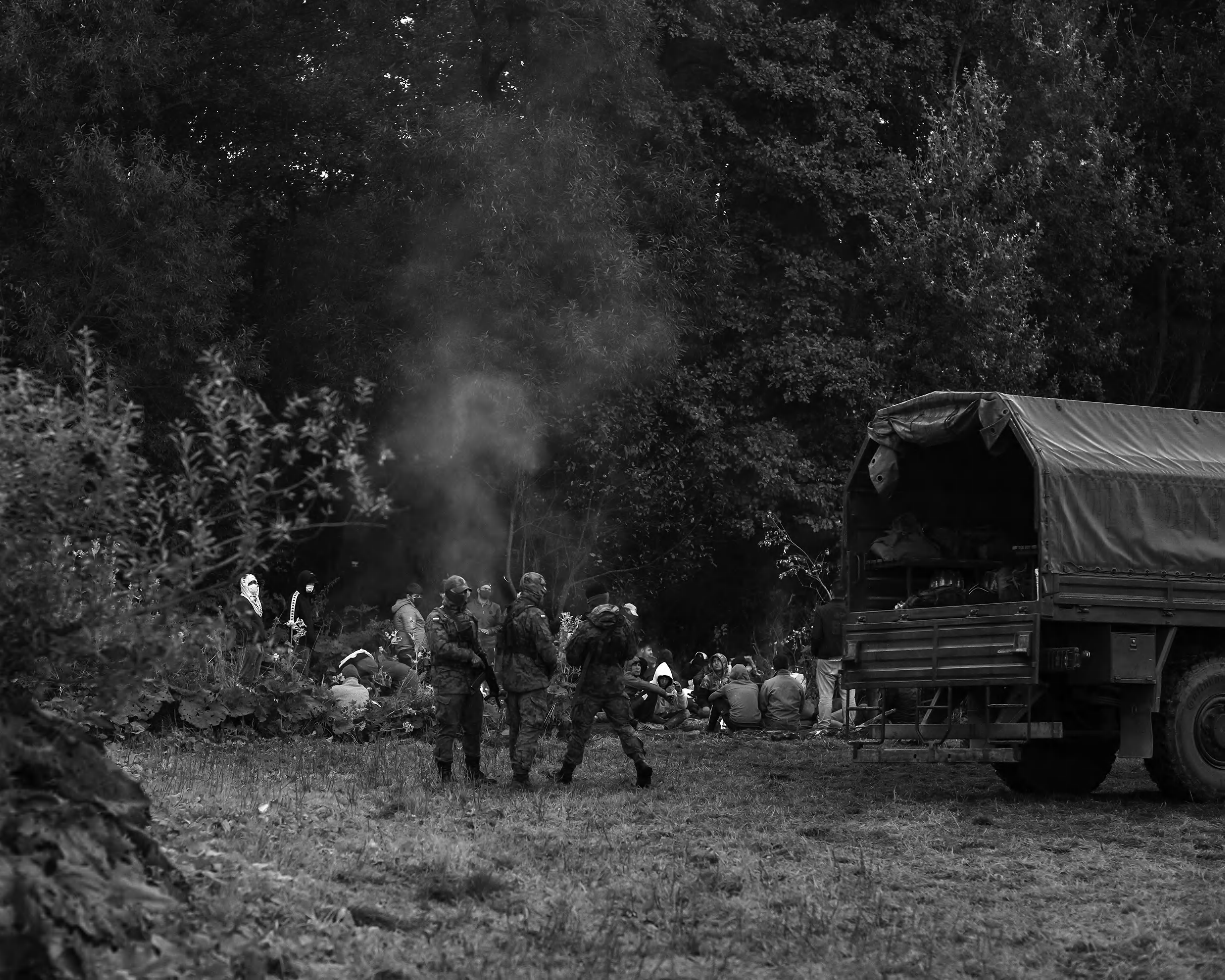 A group of Afghan refugees stopped by border guards in Poland near Usnarz village.