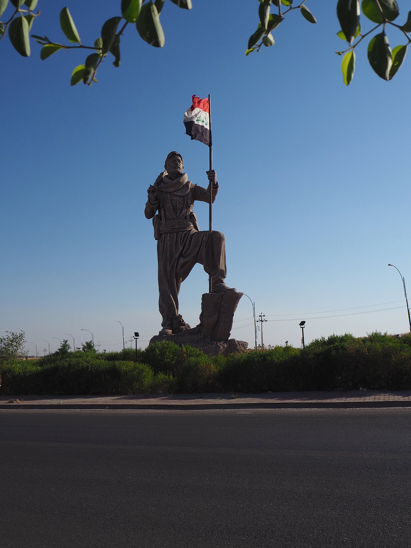 A giant Peshmerga statue on the Kirkuk-Erbil road, completed shortly before the 2017 Referendum, now flies the Iraqi, rather than Kurdish, flag. A giant Peshmerga statue on the Kirkuk-Erbil road, completed shortly before the 2017 Referendum, now flies the Iraqi, rather than Kurdish, flag.