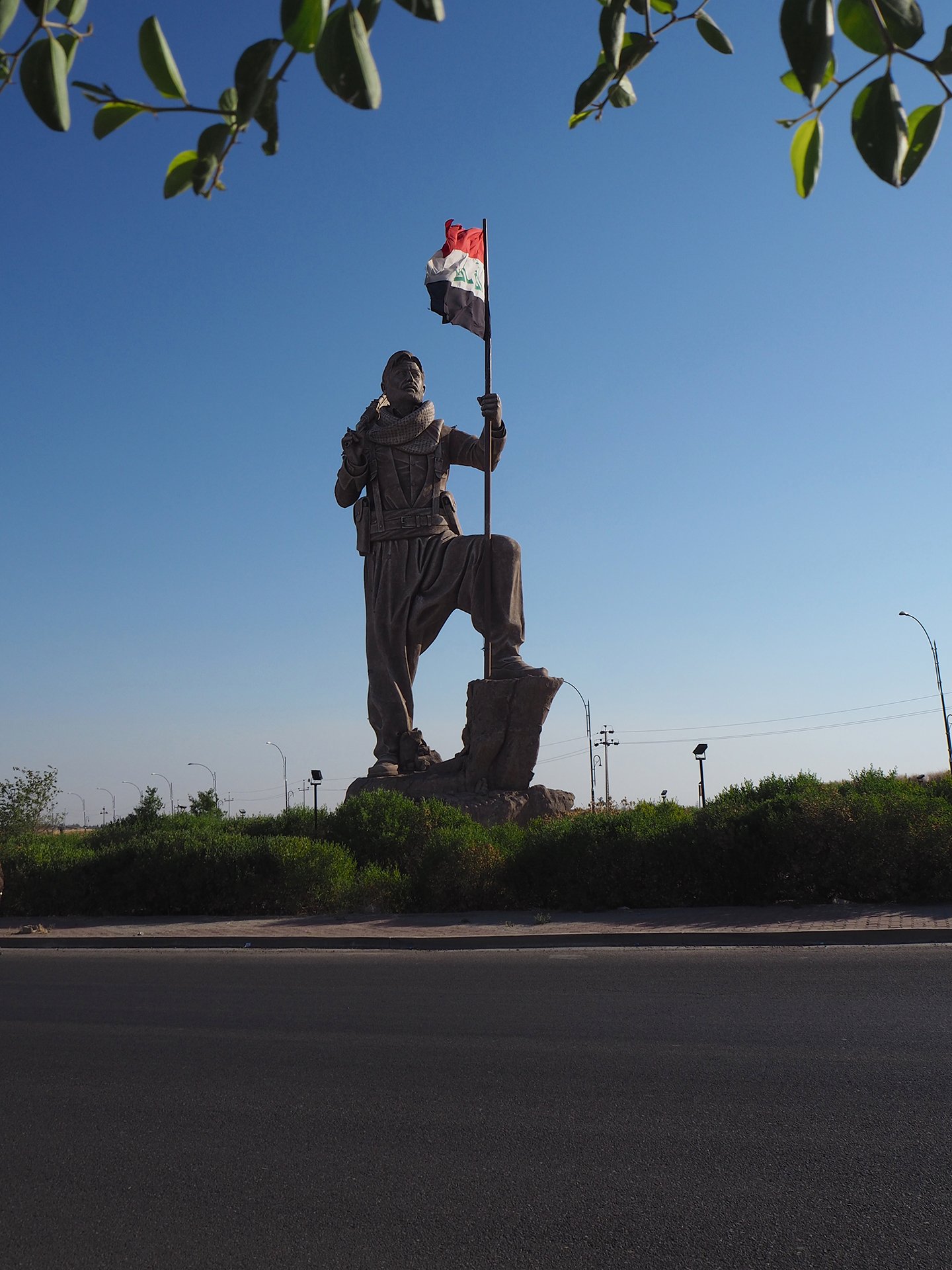 A giant Peshmerga statue on the Kirkuk-Erbil road, completed shortly before the 2017 Referendum, now flies the Iraqi, rather than Kurdish, flag.