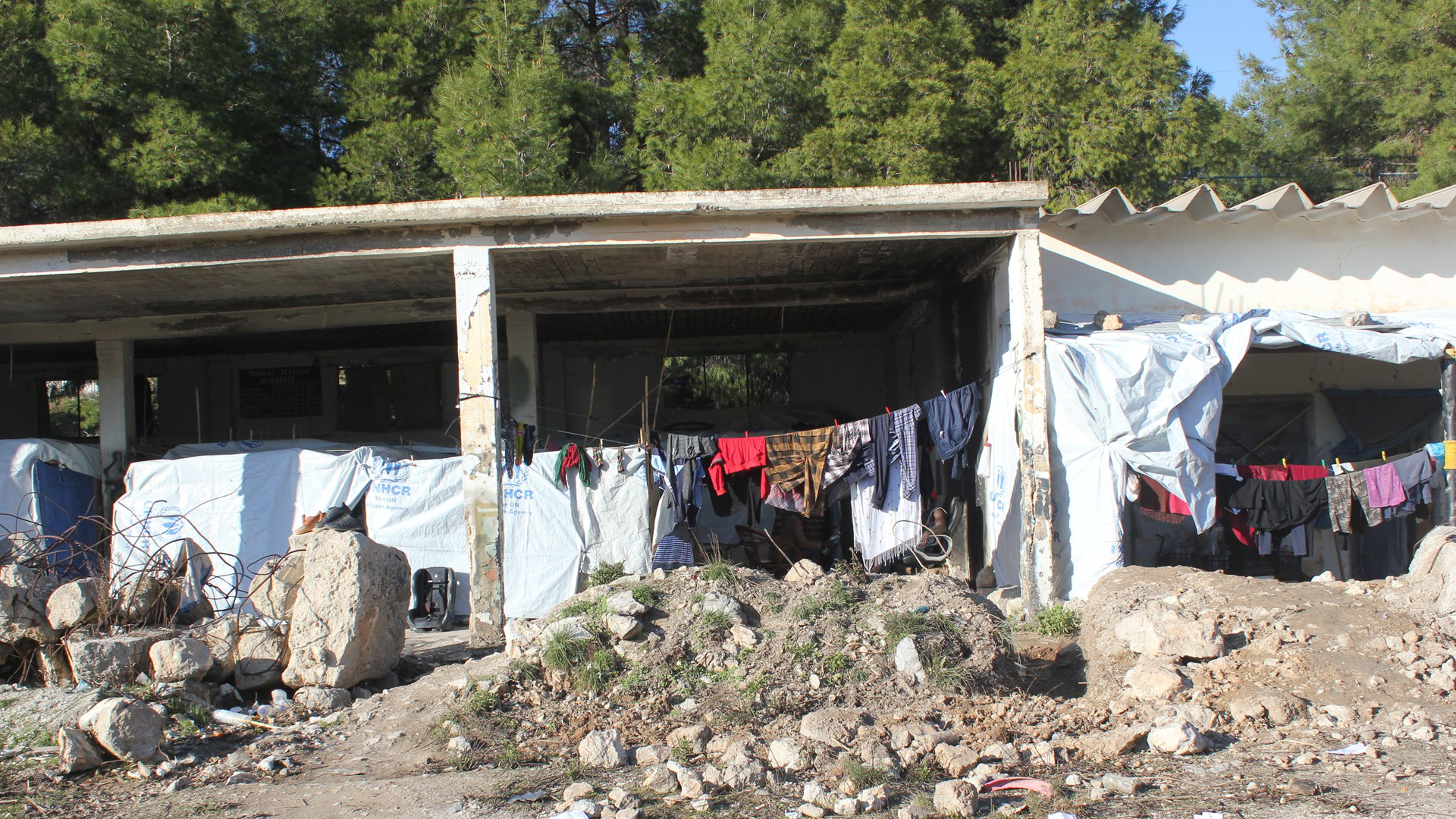 Families, who ran away to find a safe country, now they have to make do with abandoned crumbling outhouse, to put a roof under themselves to somehow feel safe.