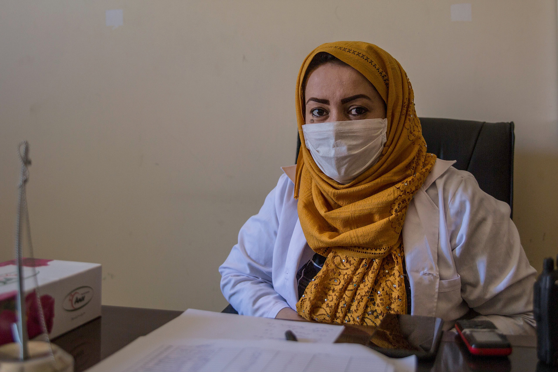 Fauzia Abrar sits at her desk at a COVID-19 hospital in Herat