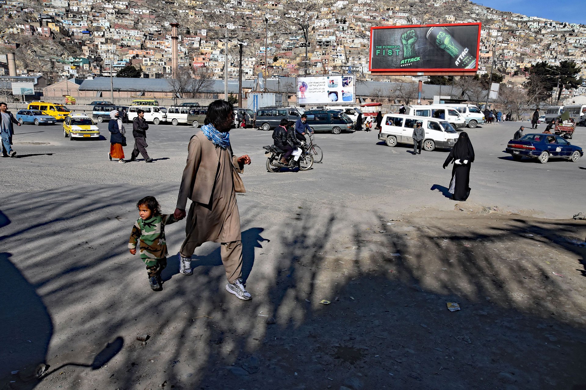  People walking in the streets of Afghanistan's capital Kabul earlier this year. Some young Afghans say they are more comfortable moving around because of a reduction in violence and street harassment of women.